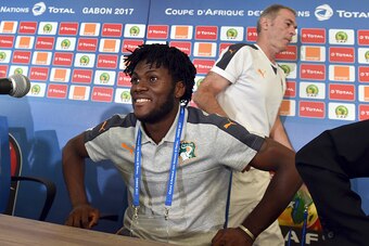 Ivory Coast's national football team coach Michel Dussyer (L) and player Franck Kessie (R) leaves after a press conference on January 15, 2017 at the Oyem Stadium on the eve of their match Ivory Coast vs Togo in the 2017 Africa Cup of Nations football tou