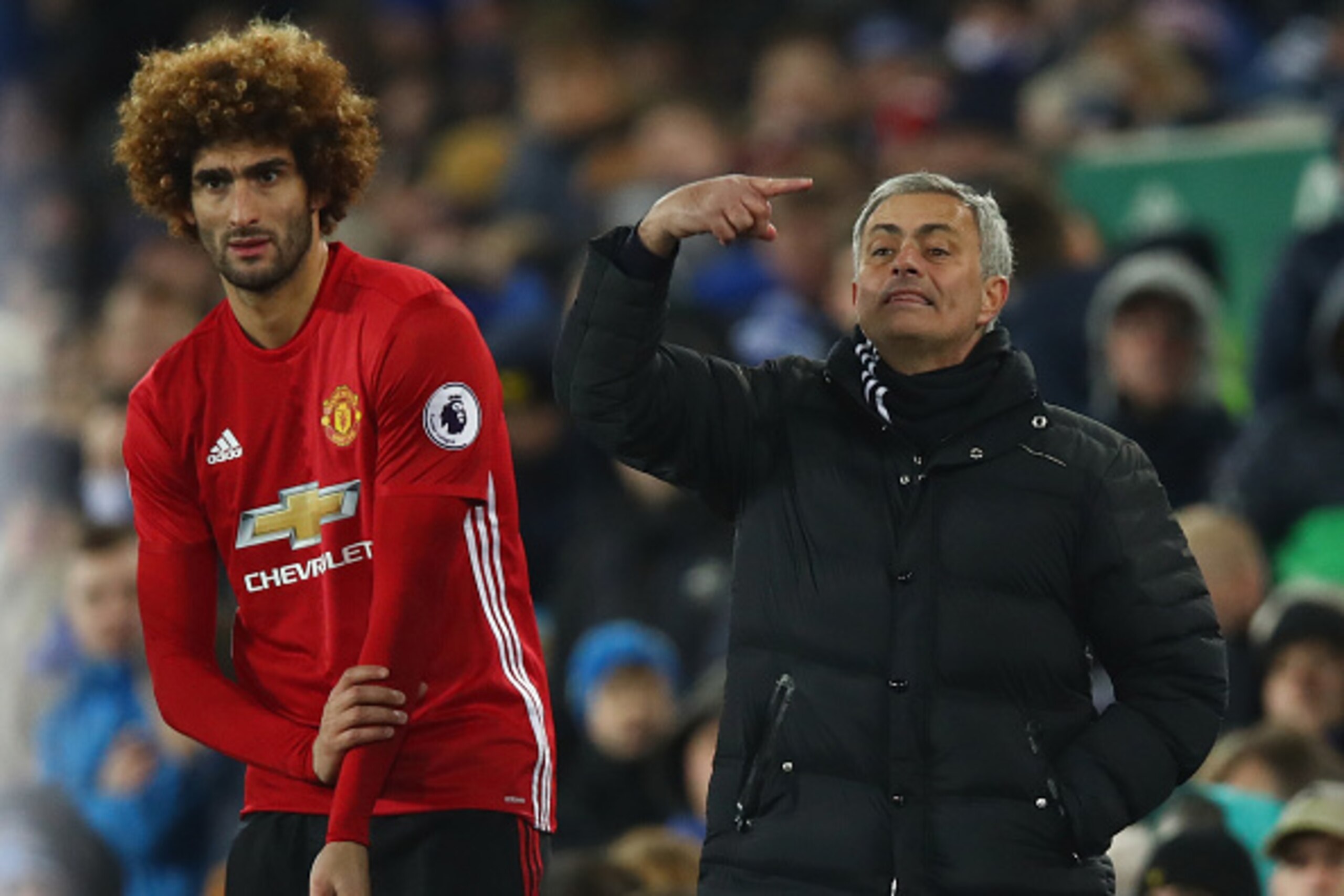 LIVERPOOL, ENGLAND - DECEMBER 04:  Jose Mourinho manager of Manchester United stands alongside his substitute Marouane Fellaini of Manchester United during the Premier League match between Everton and Manchester United at Goodison Park on December 4, 2016