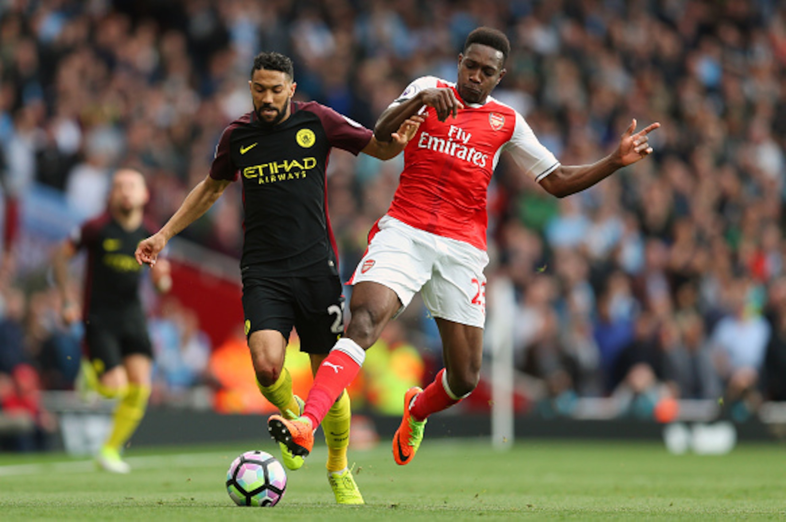 LONDON, ENGLAND - APRIL 02: Gael Clichy of Manchester City and Danny Welbeck of Arsenal during the Premier League match between Arsenal and Manchester City at Emirates Stadium on April 2, 2017 in London, England. (Photo by Catherine Ivill - AMA/Getty Imag