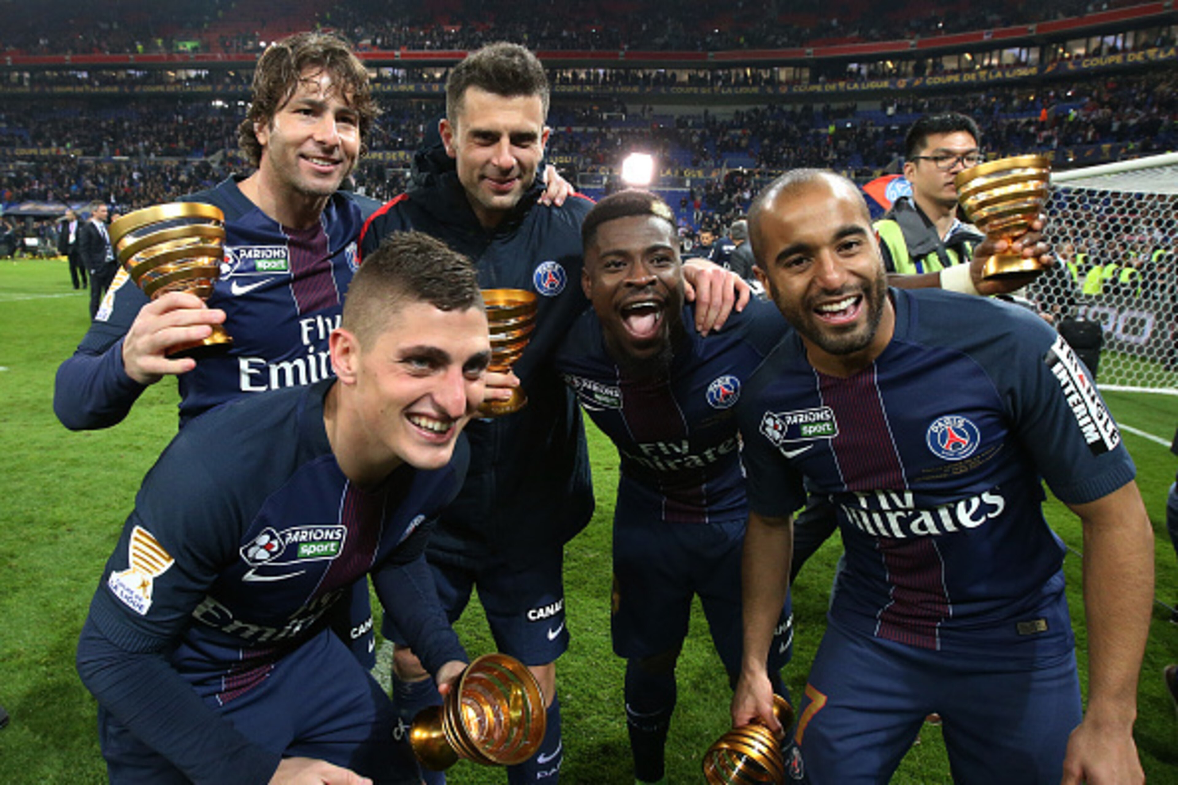 LYON, FRANCE - APRIL 1: Marco Verratti, Maxwell Scherrer, Thiago Motta, Serge Aurier, Lucas Moura of PSG celebrate the victory following the French League Cup final (Coupe de la Ligue) between Paris Saint-Germain (PSG) and AS Monaco at Parc OL on April 1,