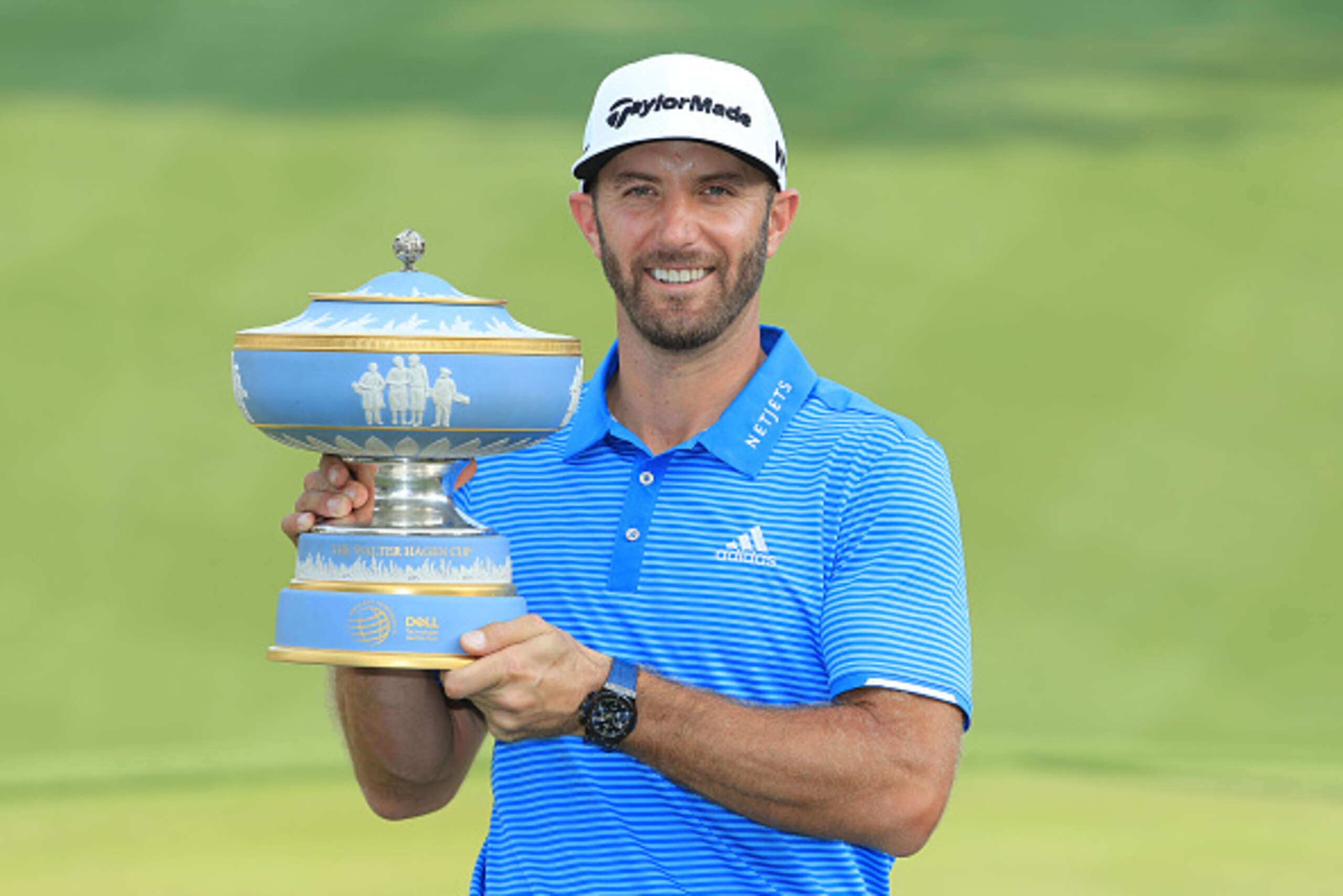AUSTIN, TX - MARCH 26:  Dustin Johnson of the USA poses with the trophy after winning the World Golf Championships-Dell Technologies Match Play at the Austin Country Club on March 26, 2017 in Austin, Texas.  (Photo by Richard Heathcote/Getty Images)