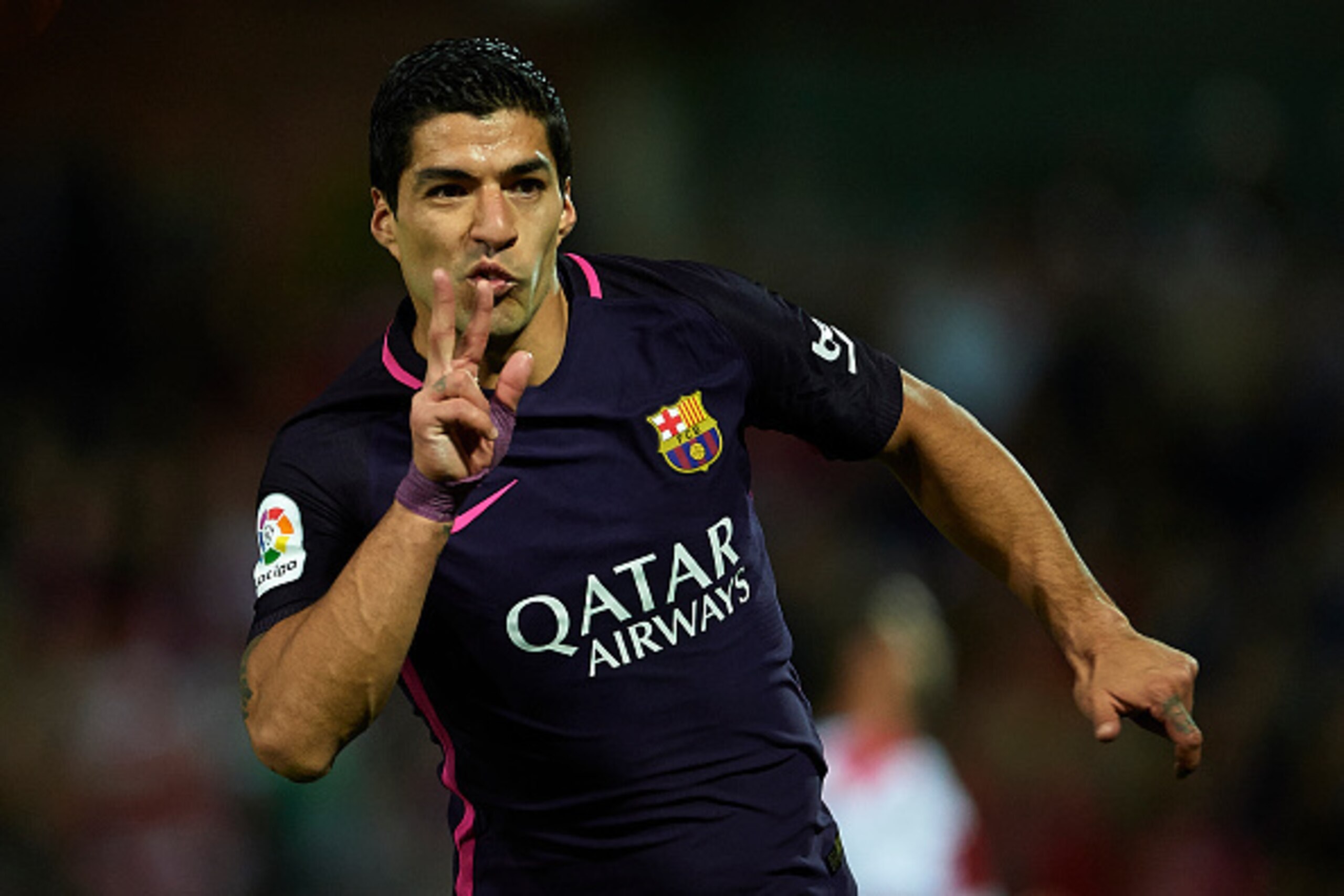 GRANADA, SPAIN - APRIL 02:  Luis Suarez of FC Barcelona celebrates after scoring the first goal for FC Barcelona during the La Liga match between Granada CF v FC Barcelona at Estadio Nuevo Los Carmenes on April 02, 2017 in Granada, Spain.  (Photo by Aitor