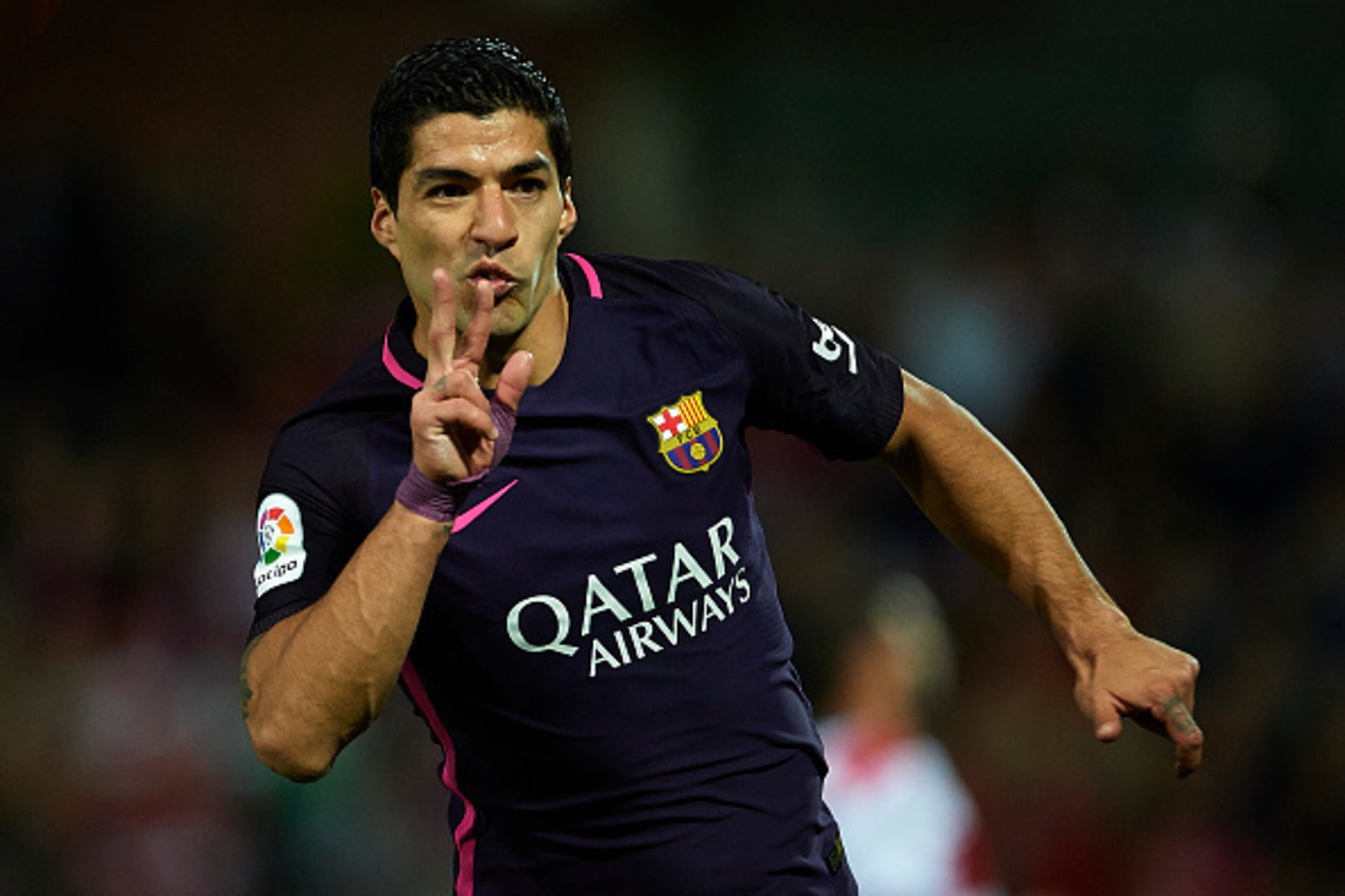 GRANADA, SPAIN - APRIL 02:  Luis Suarez of FC Barcelona celebrates after scoring the first goal for FC Barcelona during the La Liga match between Granada CF v FC Barcelona at Estadio Nuevo Los Carmenes on April 02, 2017 in Granada, Spain.  (Photo by Aitor