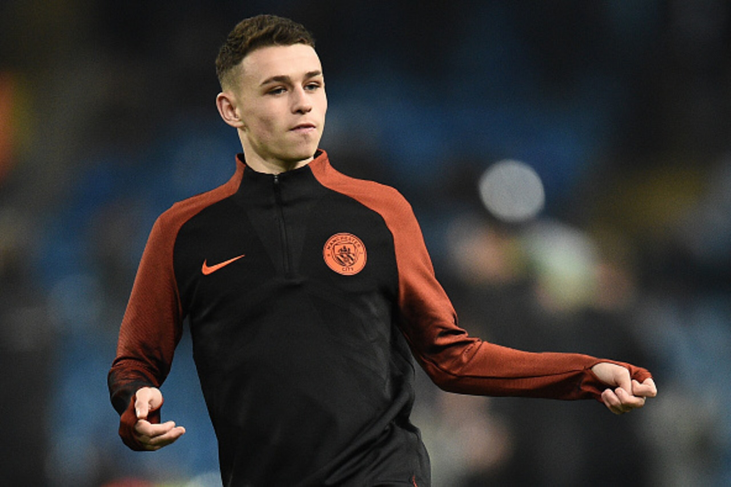 Manchester City's English midfielder Phil Foden warms up ahead of the UEFA Champions League group C football match between Manchester City and Celtic at the Etihad Stadium in Manchester, northern England, on December 6, 2016. / AFP / Oli SCARFF        (Ph