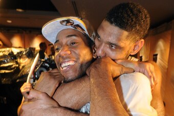 Leonard and Tim Duncan celebrate after winning the NBA championship over the Miami Heat on June 15, 2014.