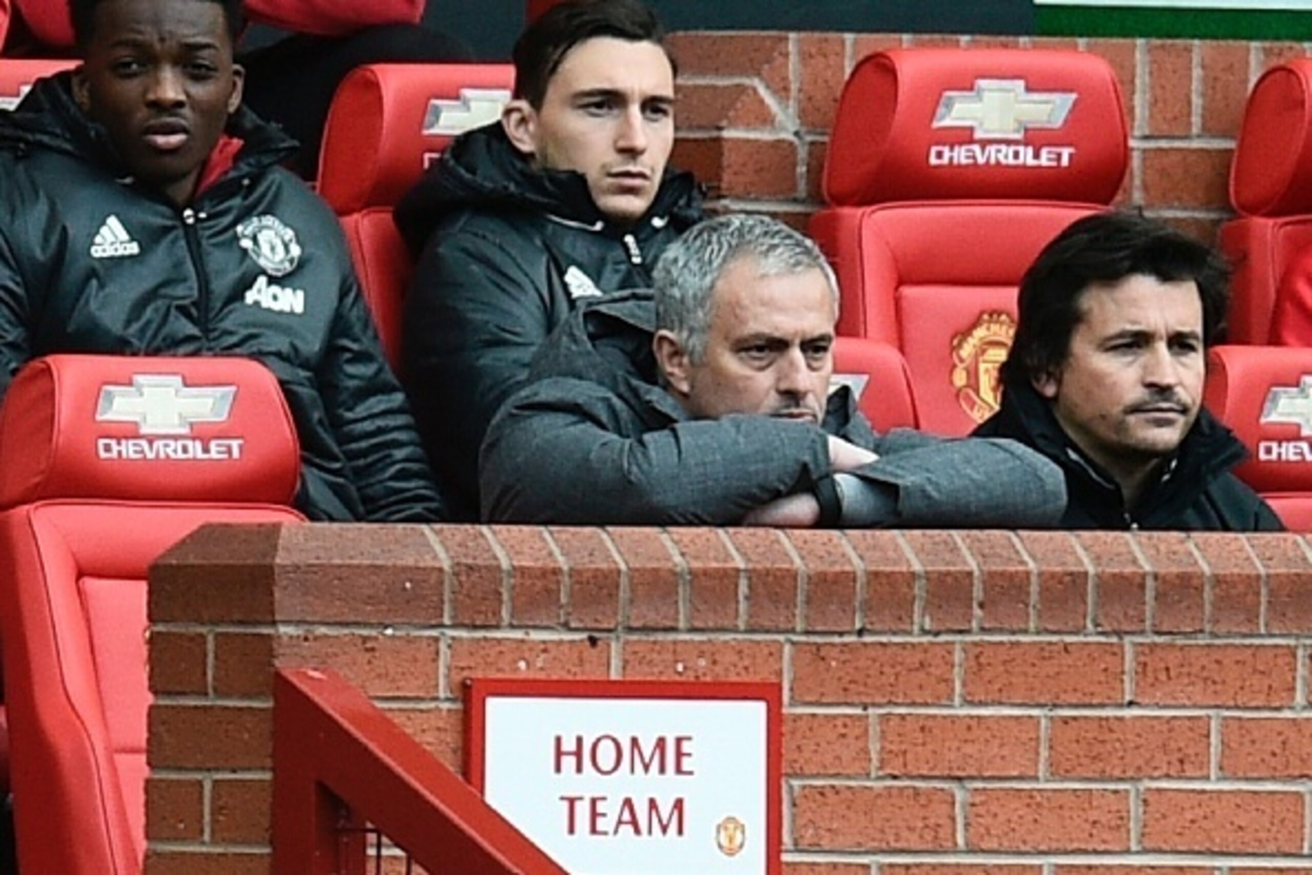 Manchester United's Portuguese manager Jose Mourinho (C) watches from the dugout seated next to Manchester United's Portuguese assistant manager Rui Faria (R) during the English Premier League football match between Manchester United and West Bromwich Alb