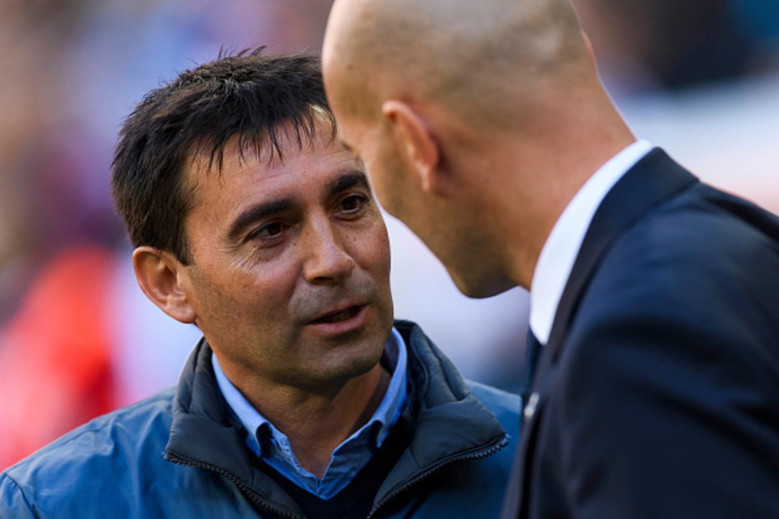 MADRID, SPAIN - NOVEMBER 06: Head coach Asier Garitano (l) of Deportivo Leganes talks to Real Madrid's coach Zinedine Zidane prior to the La Liga match between Real Madrid and Deportivo Leganes at the Estadio Santiago Bernabeu on 06 November 2016 in Madri