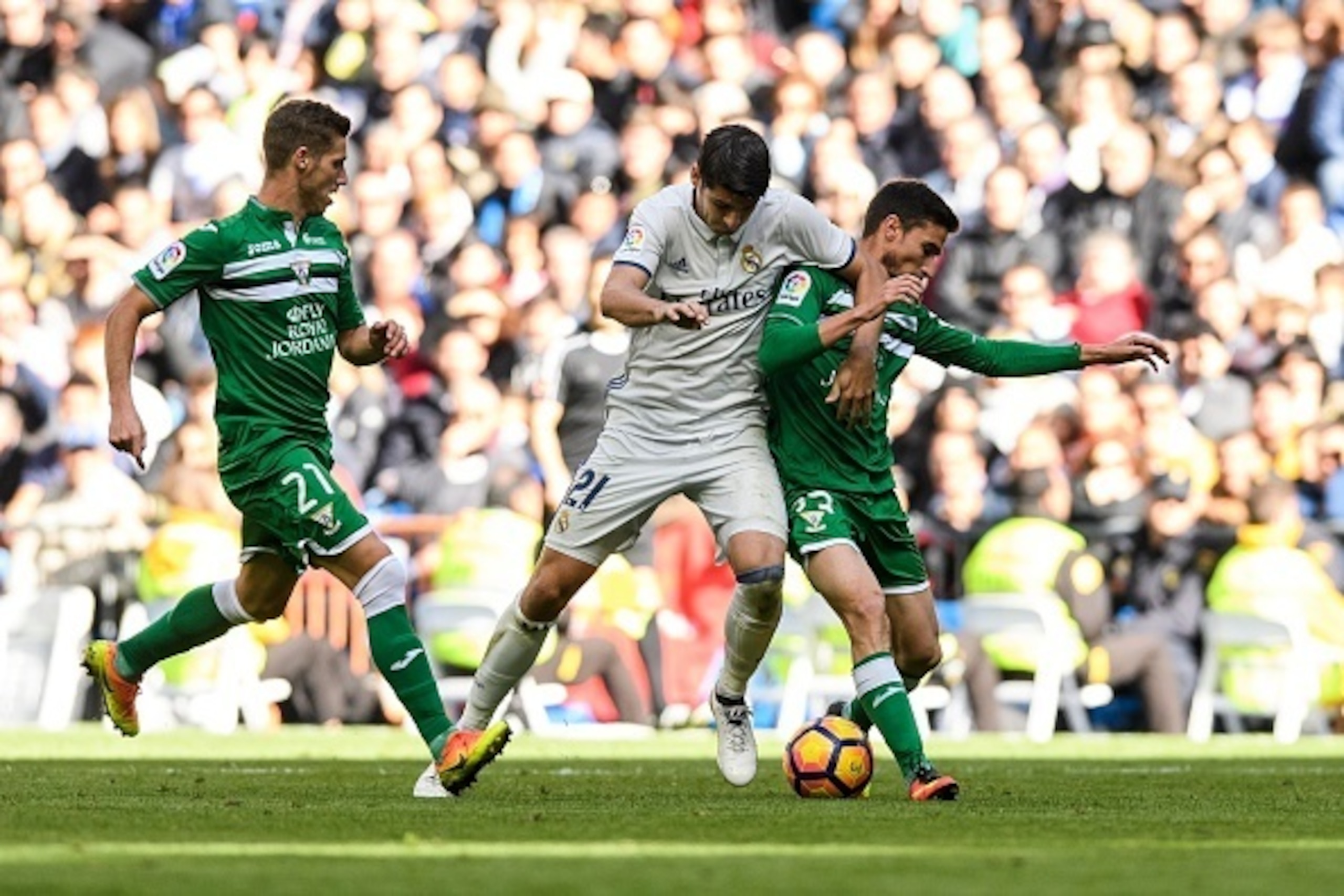 MADRID, SPAIN - NOVEMBER 06: Alvaro Morata of Real Madrid battles for the ball with Omar of Deportivo Leganes during their La Liga match between Real Madrid and Deportivo Leganes at the Estadio Santiago Bernabeu on 06 November 2016 in Madrid, Spain. (Phot