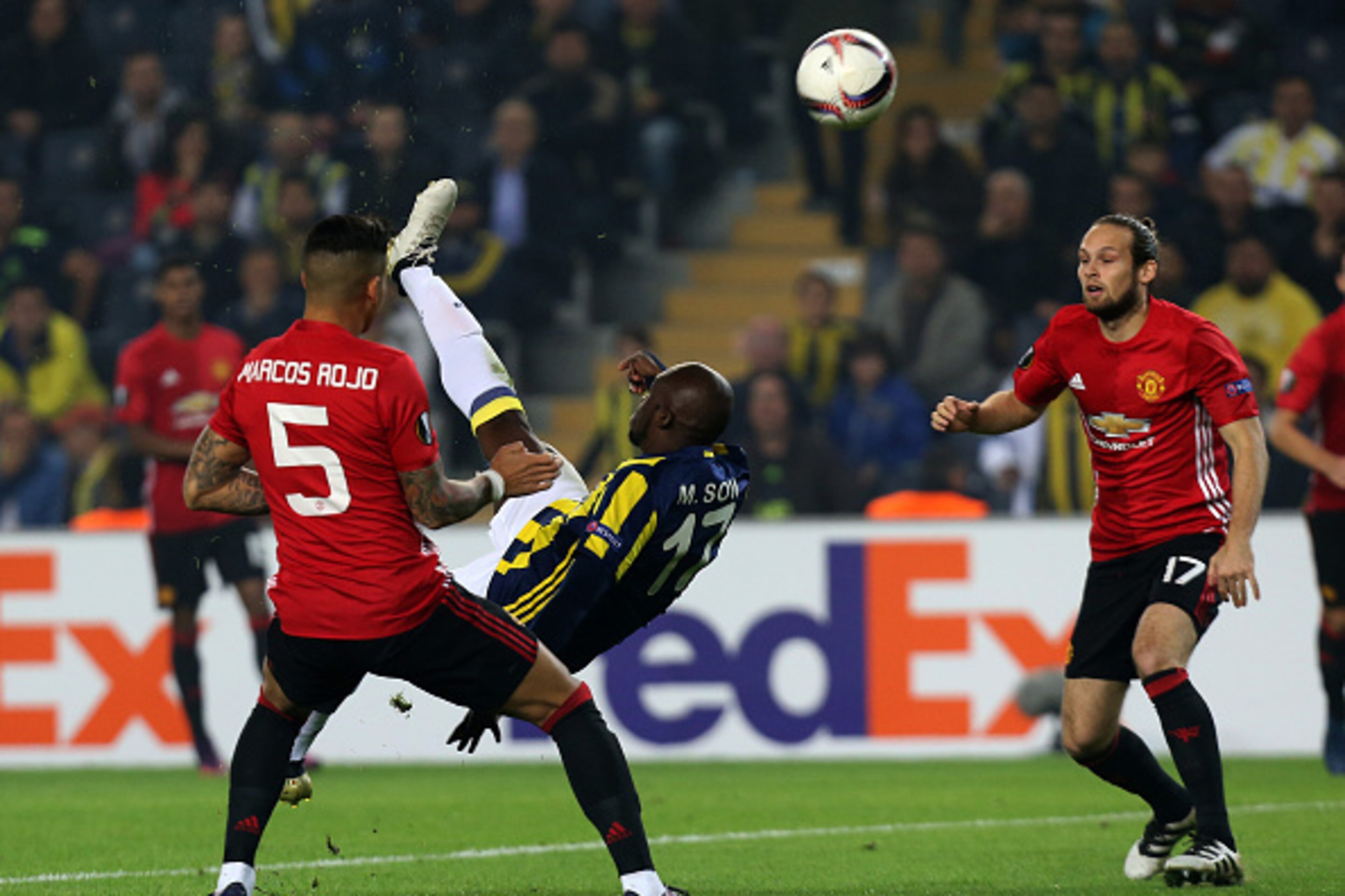 Fenerbahce's forward Moussa Sow (C) kicks the ball next to Manchester United's defender Marcos Rojo (L) and Daley Blind (R) during the UEFA Europa League football Fenerbahce SK vs Manchester United at the Fenerbahce Ulker Stadium on November 3,2016 in Ist