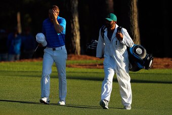 AUGUSTA, GEORGIA - APRIL 10:  Jordan Spieth of the United States and caddie Michael Greller walk to the 18th green during the final round of the 2016 Masters Tournament at Augusta National Golf Club on April 10, 2016 in Augusta, Georgia.  (Photo by Kevin 