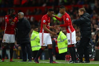 MANCHESTER, ENGLAND - DECEMBER 11: Marcus Rashford of Manchester United shakes hands with Anthony Martial during the Premier League match between Manchester United and Tottenham Hotspur at Old Trafford on December 11, 2016 in Manchester, England.  (Photo 