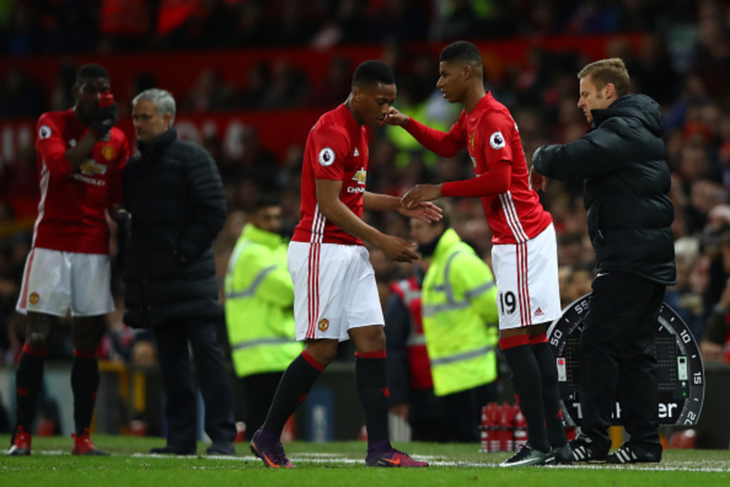 MANCHESTER, ENGLAND - DECEMBER 11: Marcus Rashford of Manchester United shakes hands with Anthony Martial during the Premier League match between Manchester United and Tottenham Hotspur at Old Trafford on December 11, 2016 in Manchester, England.  (Photo 