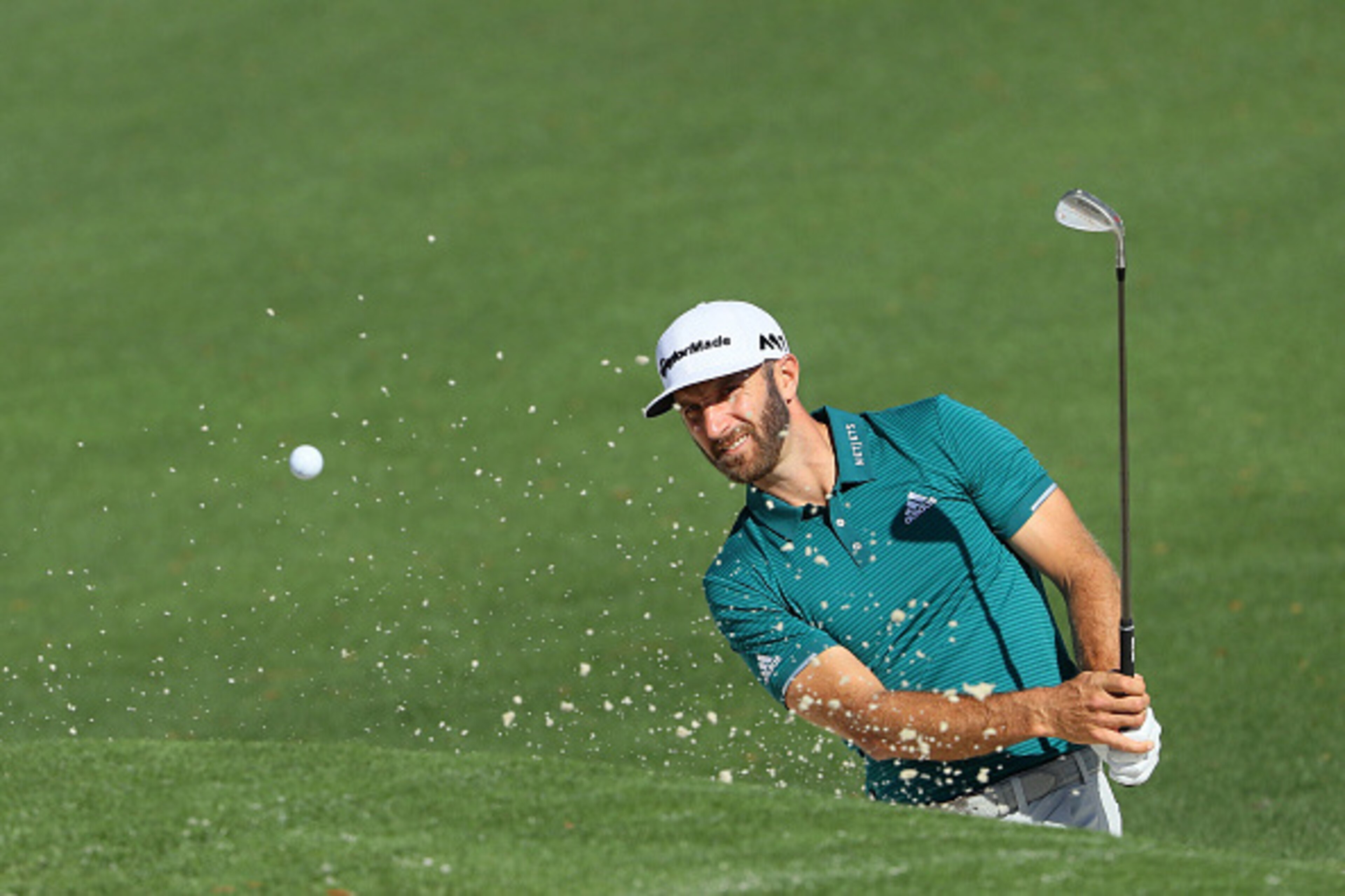 AUGUSTA, GA - APRIL 04:  Dustin Johnson of the United States plays a shot from a bunker on the second hole during a practice round prior to the start of the 2017 Masters Tournament at Augusta National Golf Club on April 4, 2017 in Augusta, Georgia.  (Phot