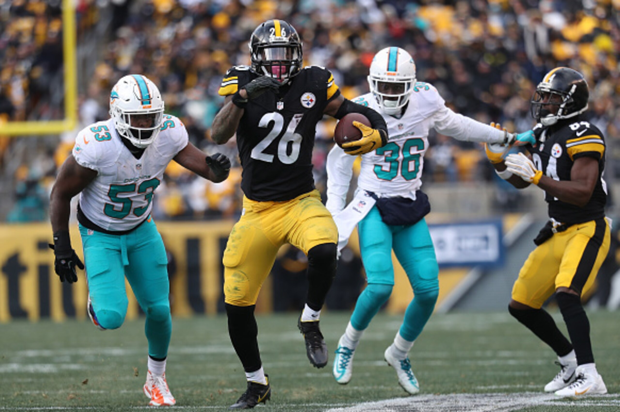 PITTSBURGH, PA - JANUARY 08: Le'Veon Bell #26 of the Pittsburgh Steelers carries the ball during the third quarter against the Miami Dolphins in the AFC Wild Card game at Heinz Field on January 8, 2017 in Pittsburgh, Pennsylvania. (Photo by Rob Carr/Get PITTSBURGH, PA - JANUARY 08: Le'Veon Bell #26 of the Pittsburgh Steelers carries the ball during the third quarter against the Miami Dolphins in the AFC Wild Card game at Heinz Field on January 8, 2017 in Pittsburgh, Pennsylvania. (Photo by Rob Carr/Get