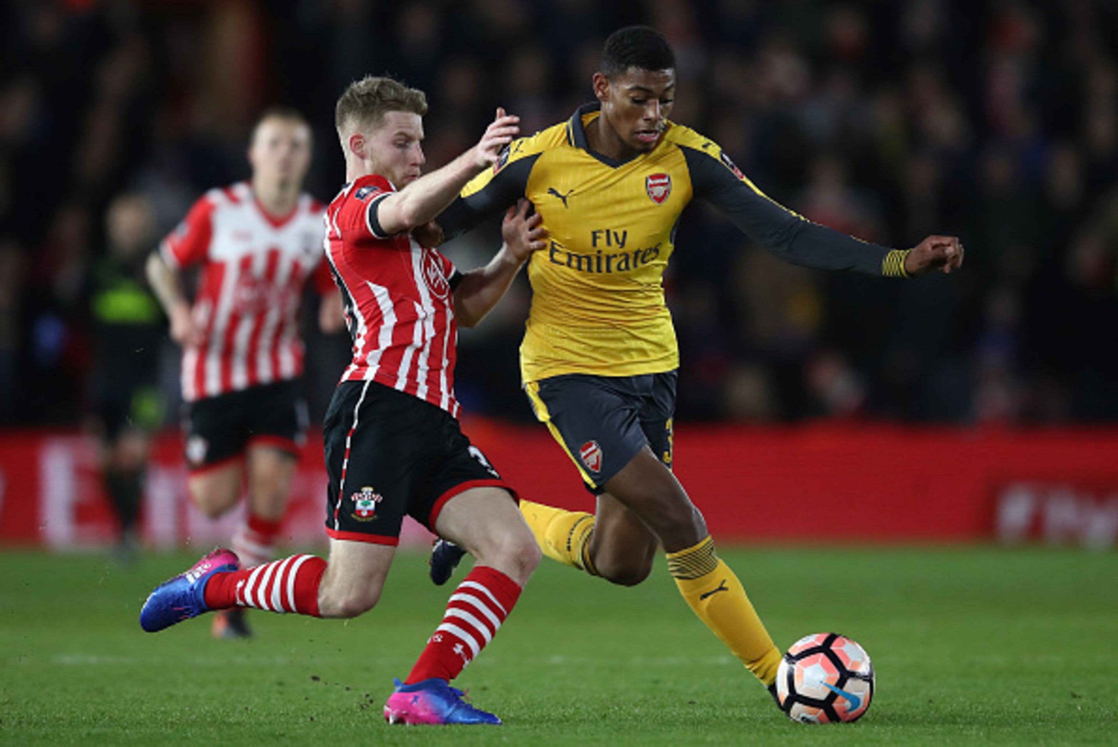 SOUTHAMPTON, ENGLAND - JANUARY 28:  Jeff Reine-Adelaide of Arsenal is tackled by Jack Stephens of Southampton  during the Emirates FA Cup Fourth Round match between Southampton and Arsenal at St Mary's Stadium on January 28, 2017 in Southampton, England. 