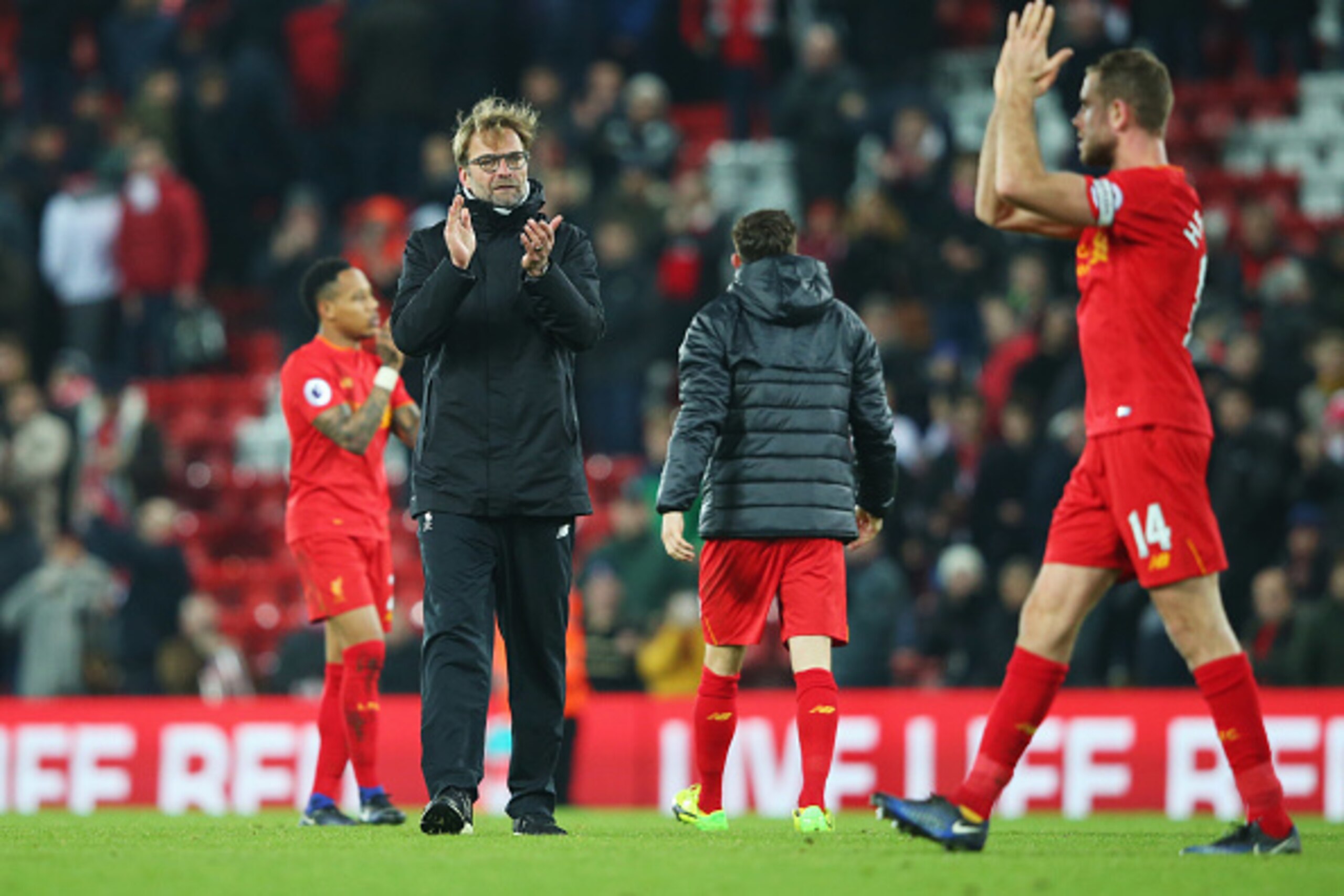 LIVERPOOL, ENGLAND - DECEMBER 27:  Jurgen Klopp manager of Liverpool and Jordan Henderson of Liverpool celebrates victory after the Premier League match between Liverpool and Stoke City at Anfield on December 27, 2016 in Liverpool, England.  (Photo by Ale
