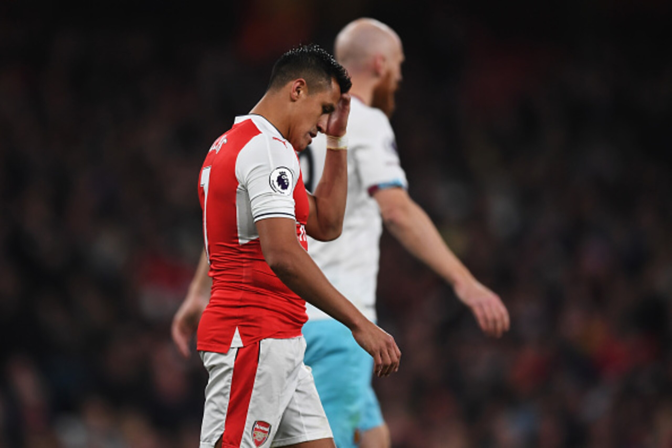 LONDON, ENGLAND - APRIL 05: Alexis Sanchez of Arsenal reacts during the Premier League match between Arsenal and West Ham United at the Emirates Stadium on April 5, 2017 in London, England.  (Photo by Shaun Botterill/Getty Images,)