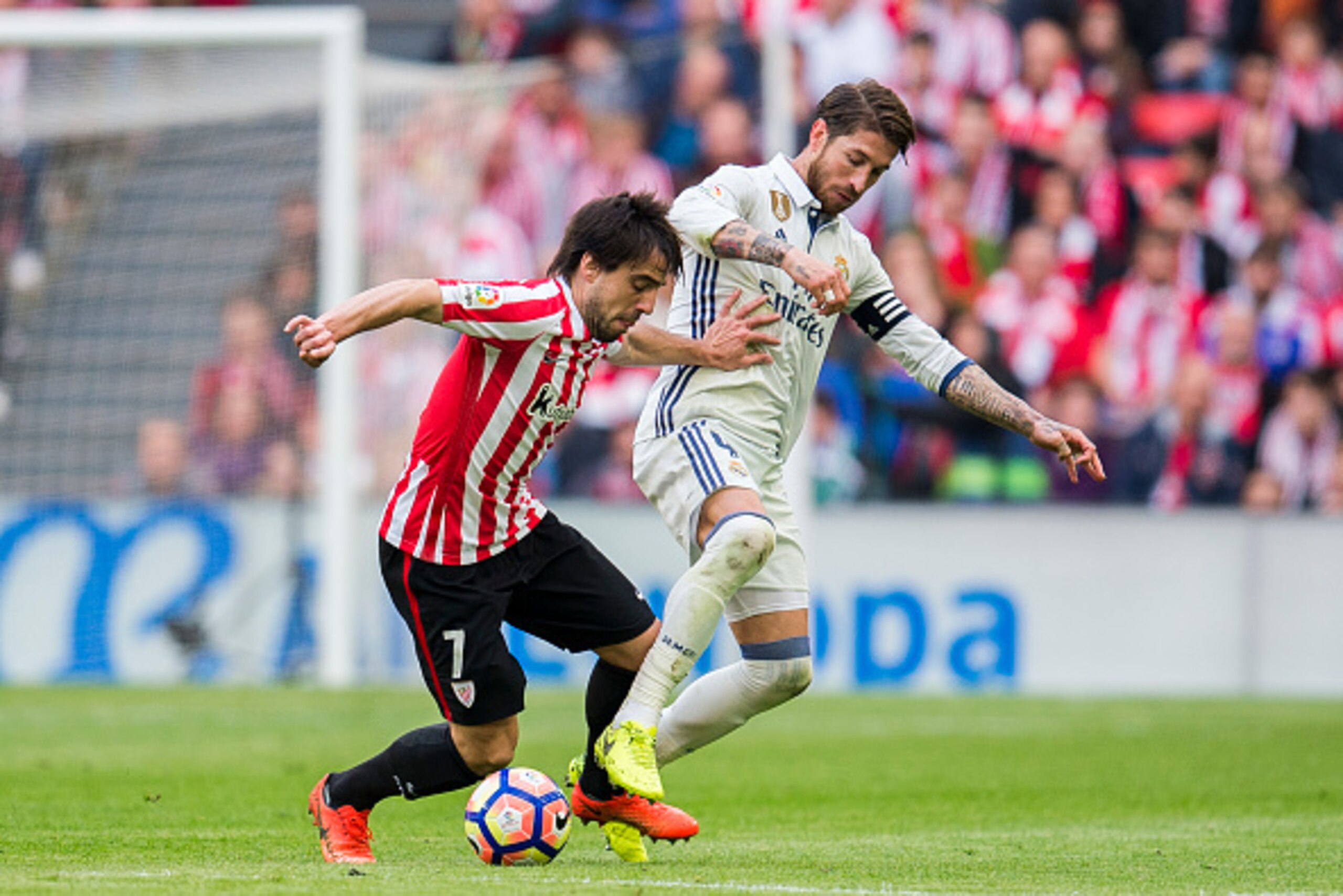 BILBAO, SPAIN - MARCH 18: Sergio Ramos of Real Madrid competes for the ball with Benat Etxebarria of Athletic Club during the La Liga match between Athletic Club Bilbao and Real Madrid at San Mames Stadium on on March 18, 2017 in Bilbao, Spain.  (Photo by