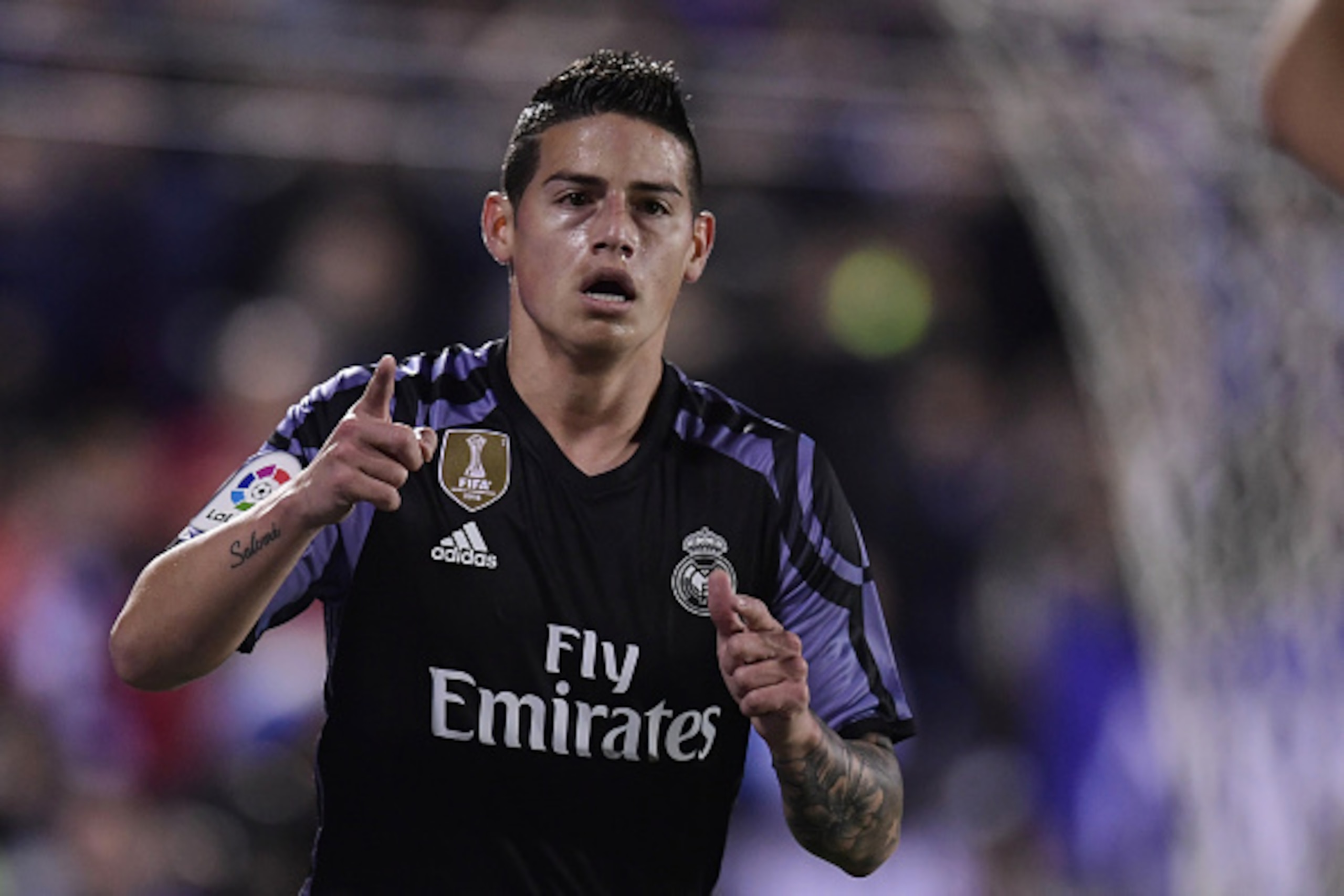 Real Madrid's Colombian midfielder James Rodriguez celebrates after scoring during the Spanish league football match Club Deportivo Leganes SAD vs Real Madrid CF at the Estadio Municipal Butarque in Leganes on the outskirts of Madrid on April 5, 2017. / A