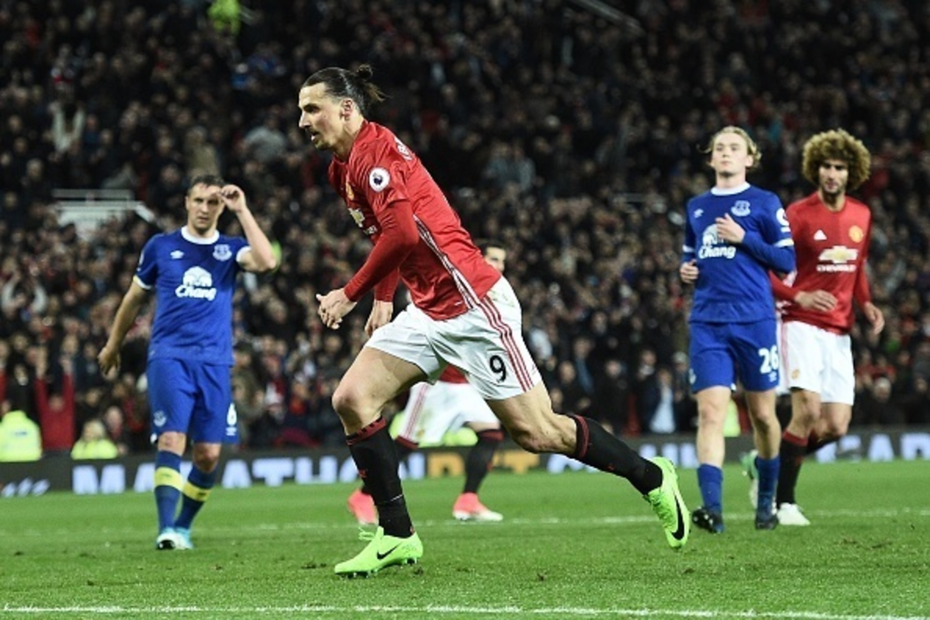 Manchester United's Swedish striker Zlatan Ibrahimovic celebrates scoring his team's first goal from the penalty spot during the English Premier League football match between Manchester United and Everton at Old Trafford in Manchester, north west England,