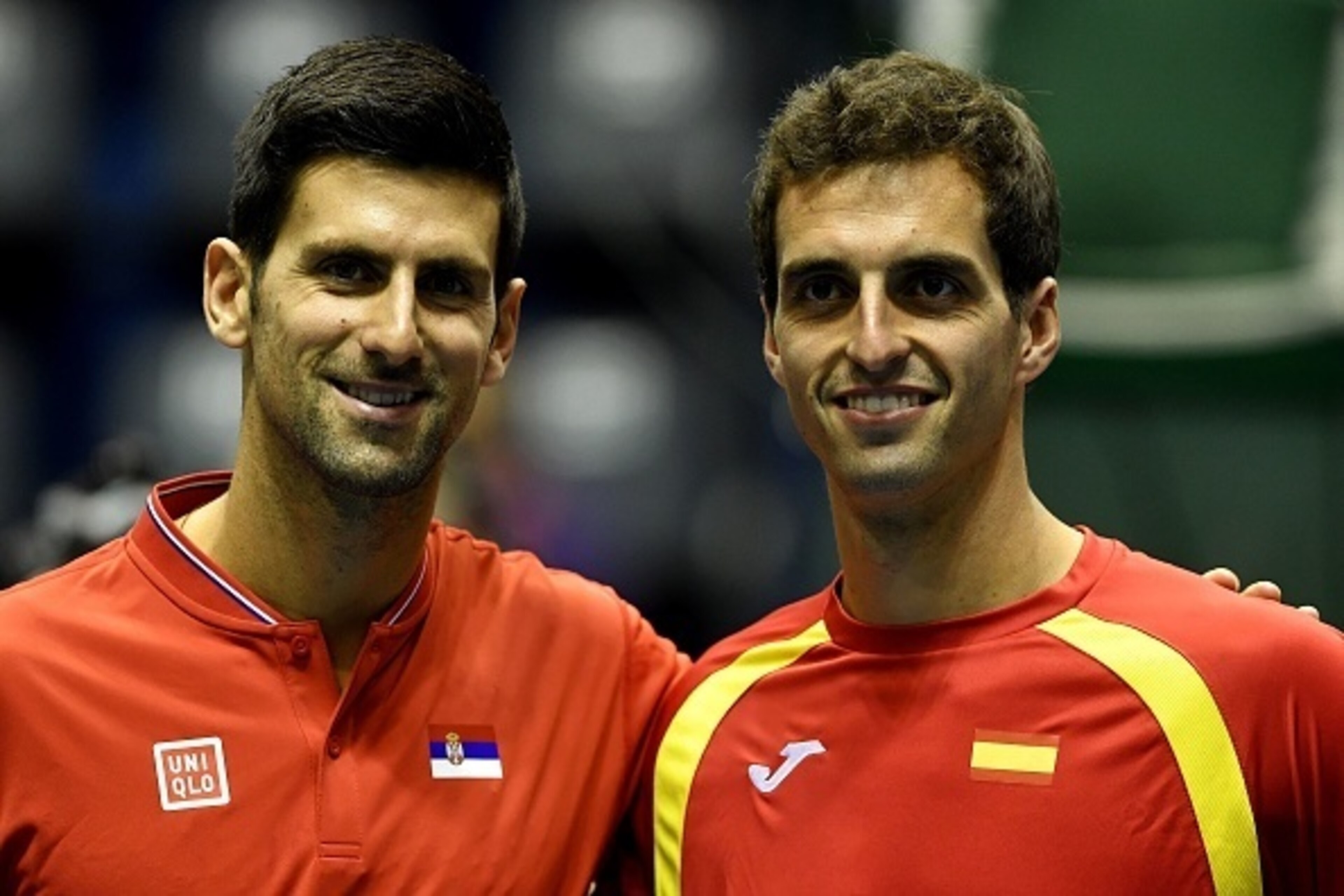 Serbia's Novak Djokovic (L) and Spain's Albert Ramos-Vinolas pose for a picture ahead of the Davis Cup World Group quarterfinals single match between Serbia and Spain at the 'Aleksandar Nikolic' sports hall in Belgrade, on April 7, 2017. / AFP PHOTO / AND