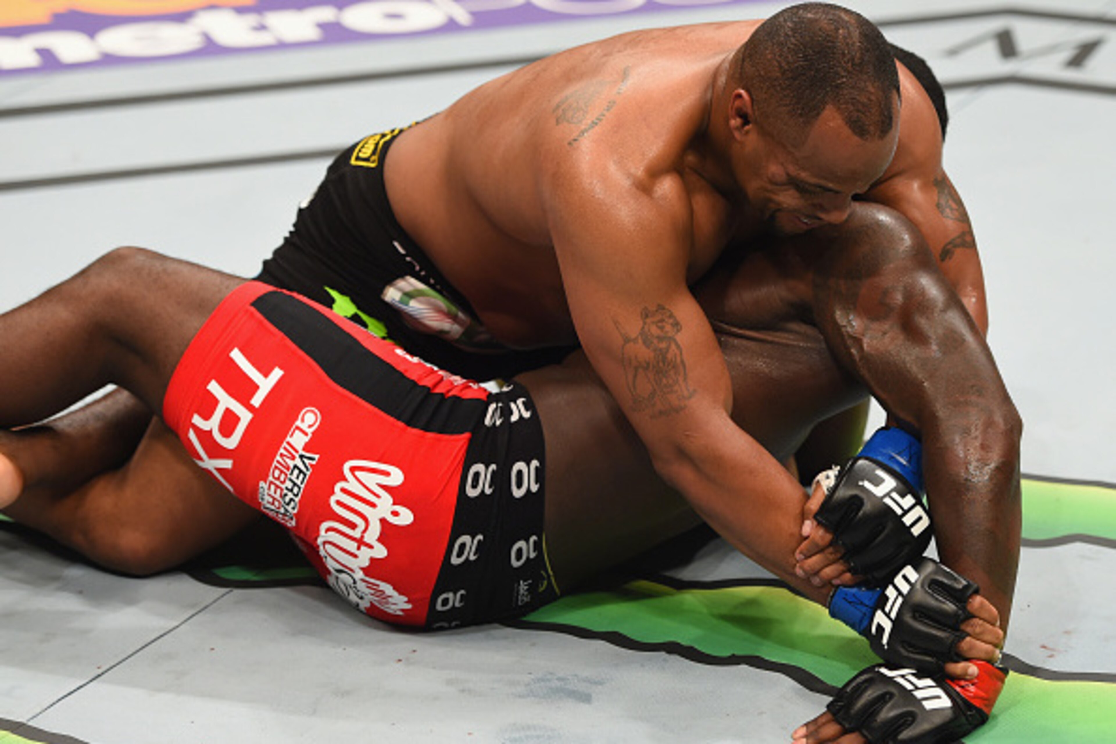 LAS VEGAS, NV - MAY 23:  Daniel Cormier (top) attempts to submit Anthony Johnson in their UFC light heavyweight championship bout during the UFC 187 event at the MGM Grand Garden Arena on May 23, 2015 in Las Vegas, Nevada.  (Photo by Josh Hedges/Zuffa LLC