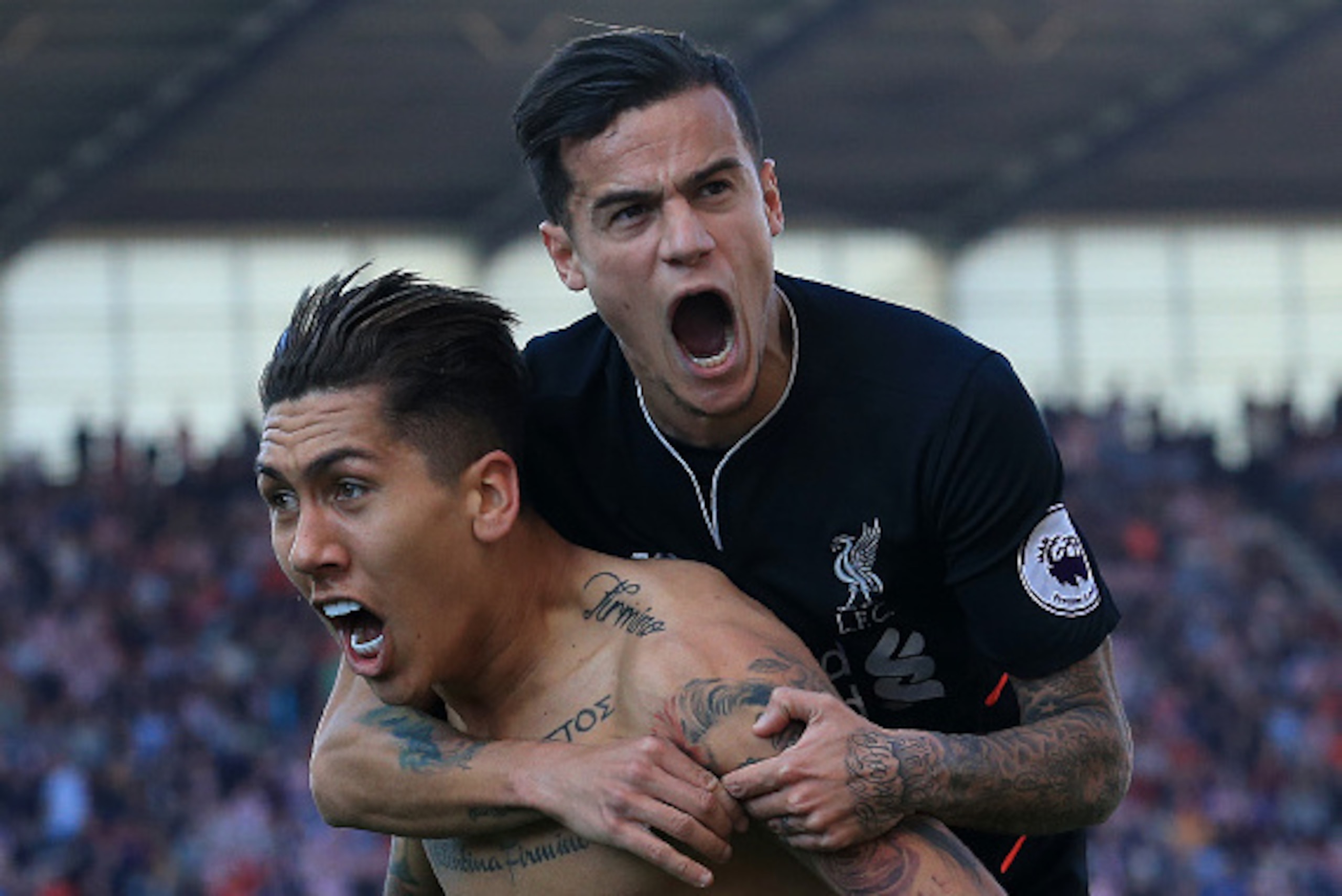 Liverpool's Brazilian midfielder Roberto Firmino (L) celebrates scoring his team's second goal with Liverpool's Brazilian midfielder Philippe Coutinho during the English Premier League football match between Stoke City and Liverpool at the Bet365 Stadium Liverpool's Brazilian midfielder Roberto Firmino (L) celebrates scoring his team's second goal with Liverpool's Brazilian midfielder Philippe Coutinho during the English Premier League football match between Stoke City and Liverpool at the Bet365 Stadium