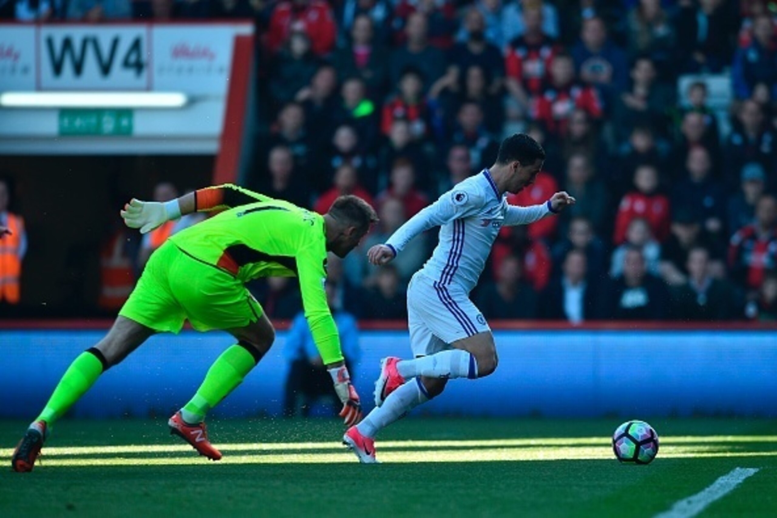 Chelsea's Belgian midfielder Eden Hazard (R) rounds Bournemouth's Polish goalkeeper Artur Boruc (L) to score their second goal during the English Premier League football match between Bournemouth and Chelsea at the Vitality Stadium in Bournemouth, souther Chelsea's Belgian midfielder Eden Hazard (R) rounds Bournemouth's Polish goalkeeper Artur Boruc (L) to score their second goal during the English Premier League football match between Bournemouth and Chelsea at the Vitality Stadium in Bournemouth, souther