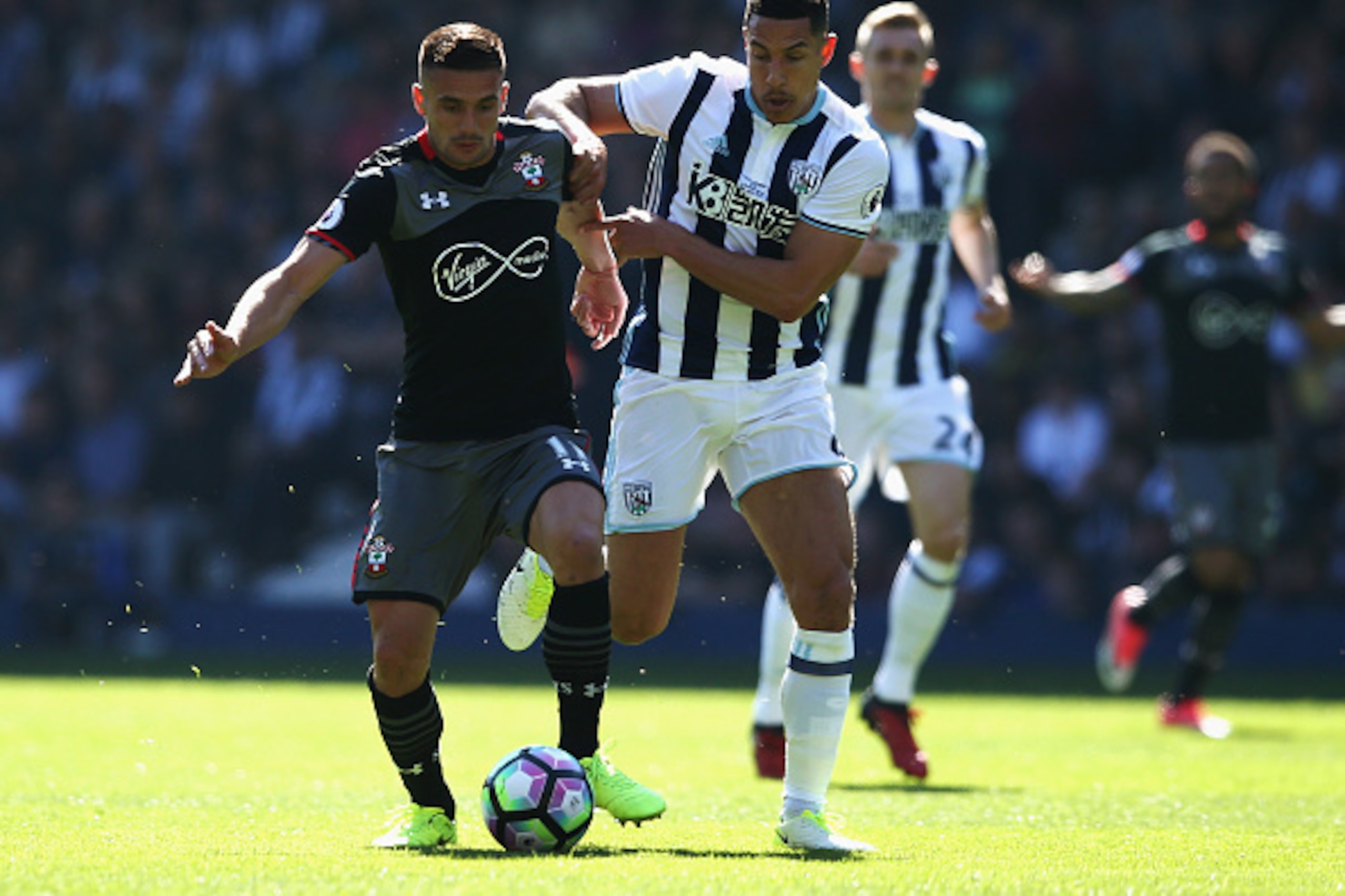 WEST BROMWICH, ENGLAND - APRIL 08:  Dusan Tadic of Southampton (L) and Jake Livermore of West Bromwich Albion (R) battle for possession during the Premier League match between West Bromwich Albion and Southampton at The Hawthorns on April 8, 2017 in West 