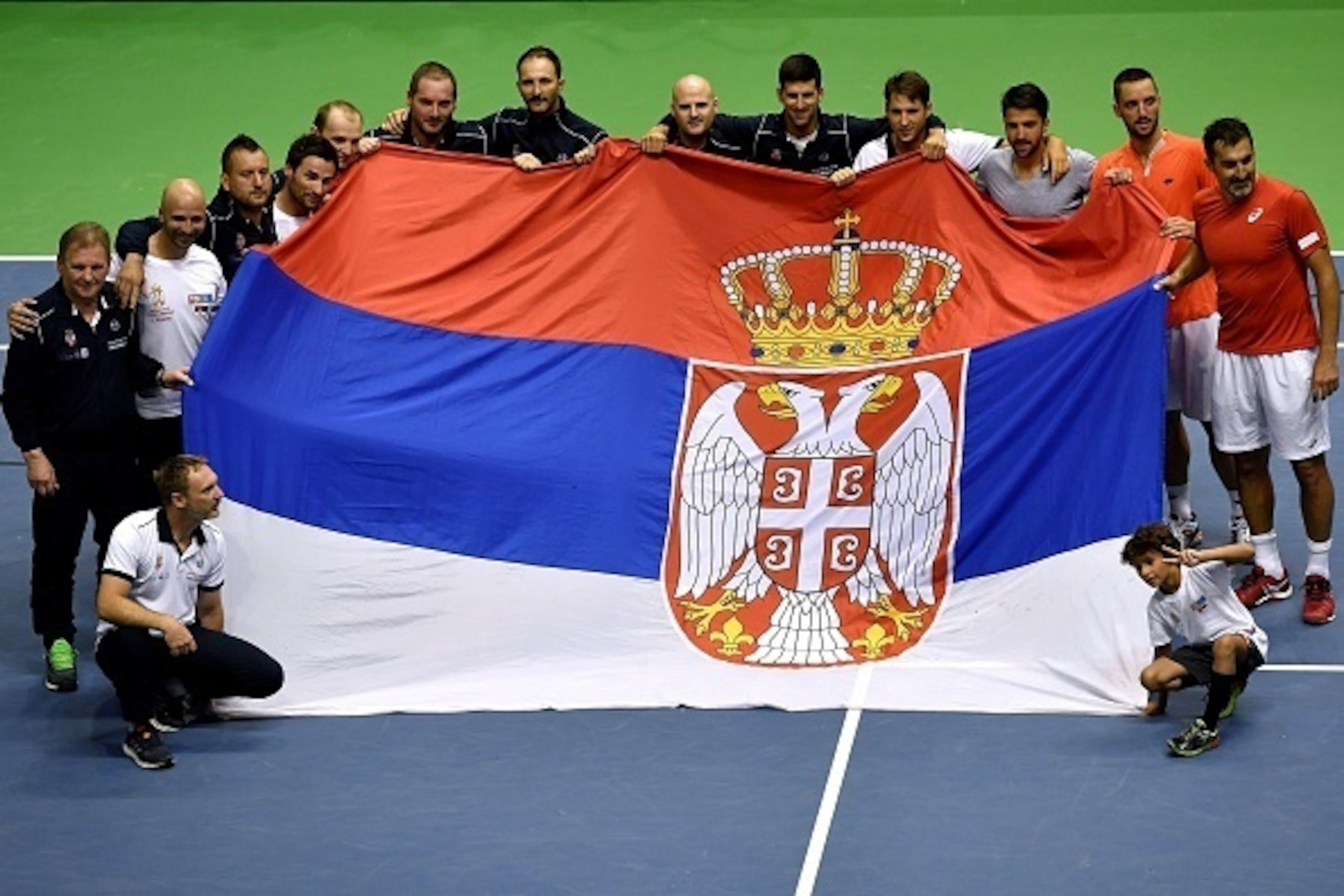Serbia's tennis team celebrate their victory after the Davis Cup World Group quarter-final between Serbia and Spain  at the Aleksandar Nikolic Sports Hall in Belgrade, on April 8, 2017. / AFP PHOTO / ANDREJ ISAKOVIC        (Photo credit should read ANDREJ