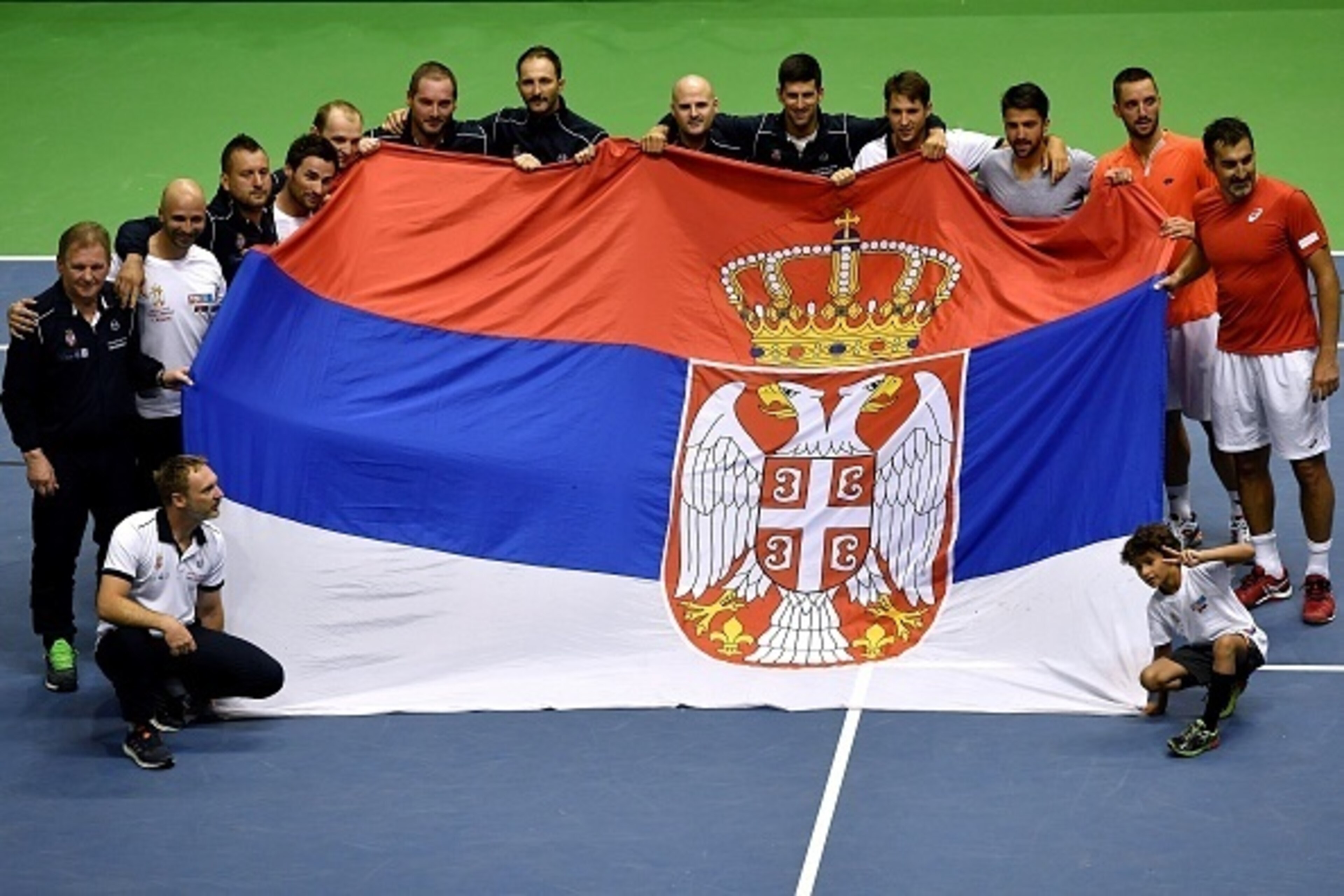 Serbia's tennis team celebrate their victory after the Davis Cup World Group quarter-final between Serbia and Spain  at the Aleksandar Nikolic Sports Hall in Belgrade, on April 8, 2017. / AFP PHOTO / ANDREJ ISAKOVIC        (Photo credit should read ANDREJ