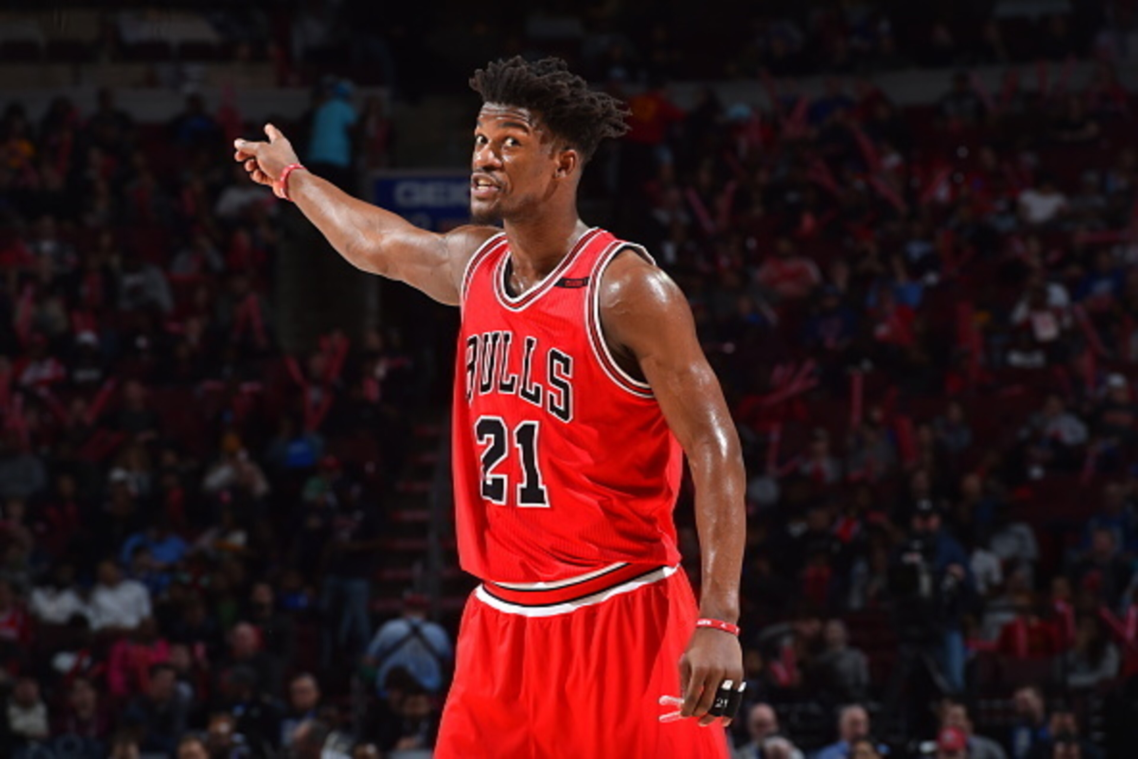 PHILADELPHIA,PA -  APRIL 6 :  Jimmy Butler #21 of the Chicago Bulls points downcourt against the Philadelphia 76ers at Wells Fargo Center on April 6, 2017 in Philadelphia, Pennsylvania NOTE TO USER: User expressly acknowledges and agrees that, by download