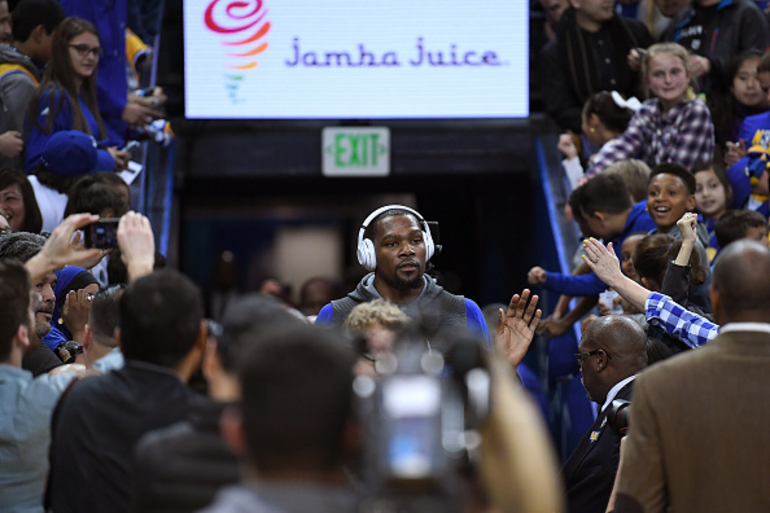 OAKLAND, CA - APRIL 08:  Kevin Durant #35 of the Golden State Warriors walks through fans an media to warms up prior to the start of an NBA Basketball game against the New Orleans Pelicans at ORACLE Arena on April 8, 2017 in Oakland, California. NOTE TO U