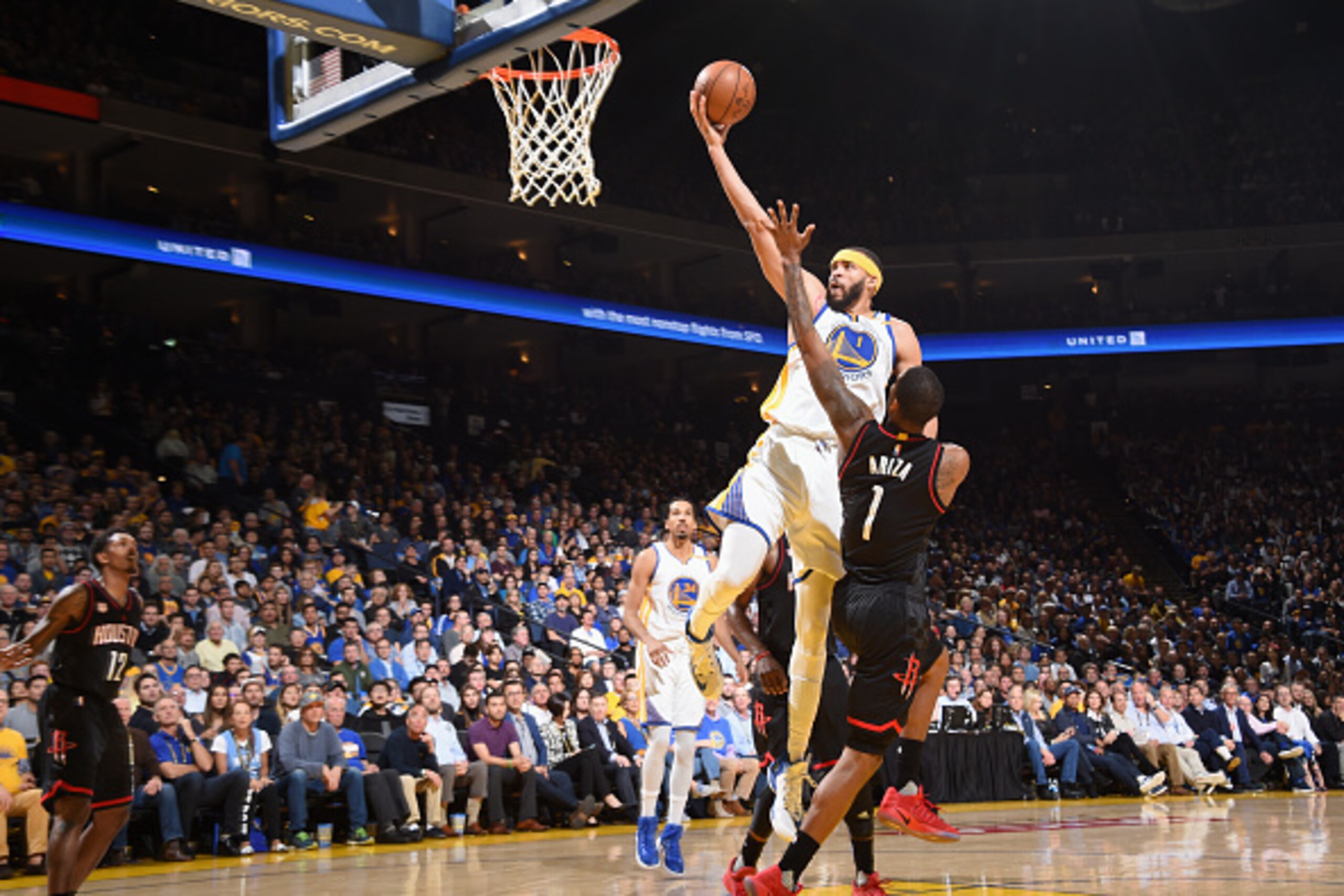 OAKLAND, CA - MARCH 31:  JaVale McGee #1 of the Golden State Warriors goes to the basket against the Houston Rockets on March 31, 2017 at ORACLE Arena in Oakland, California. NOTE TO USER: User expressly acknowledges and agrees that, by downloading and or