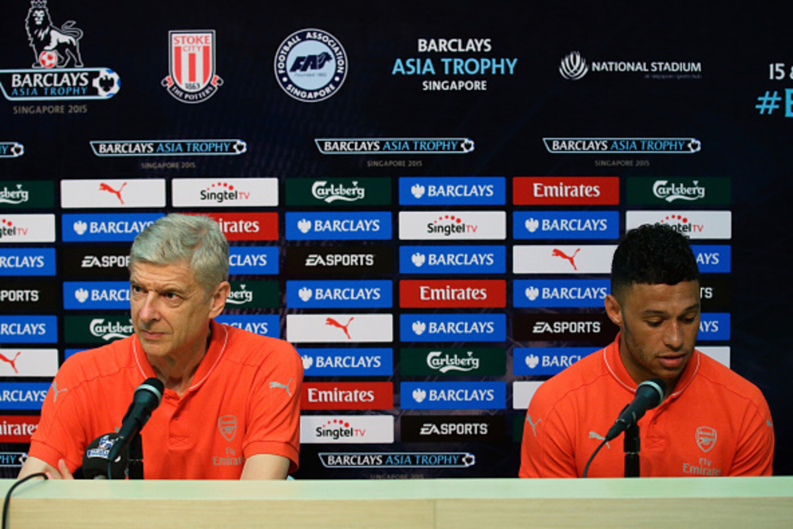 SINGAPORE - JULY 15:  Arsenal team manager, Arsene Wenger and Alex Oxlade-Chamberlain attends the Barclays Asia Trophy post match conference between Arsenal and Singapore Select XI at National Stadium on July 15, 2015 in Singapore.  (Photo by Suhaimi Abdu