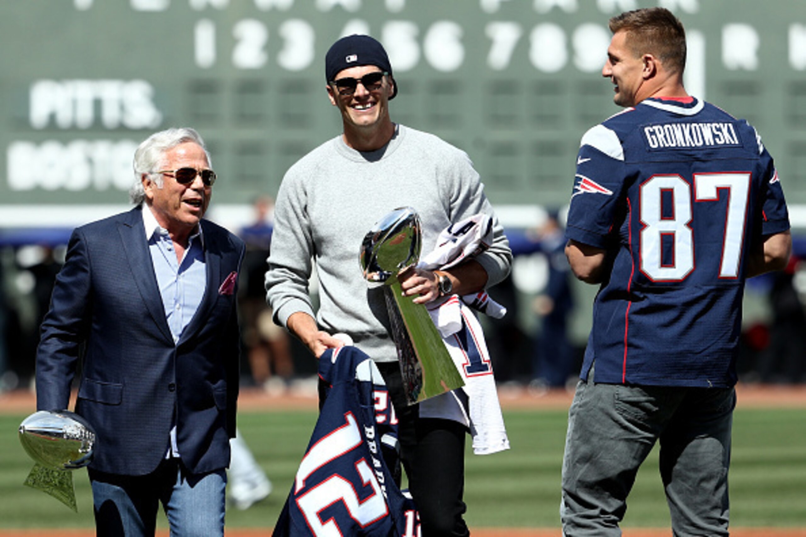 BOSTON, MA - APRIL 3: New England Patriots owner Robert Kraft talks with Tom Brady and Rob Gronkowski before the opening day game between the Boston Red Sox and the Pittsburgh Pirates at Fenway Park on April 3, 2017 in Boston, Massachusetts. (Photo by Mad