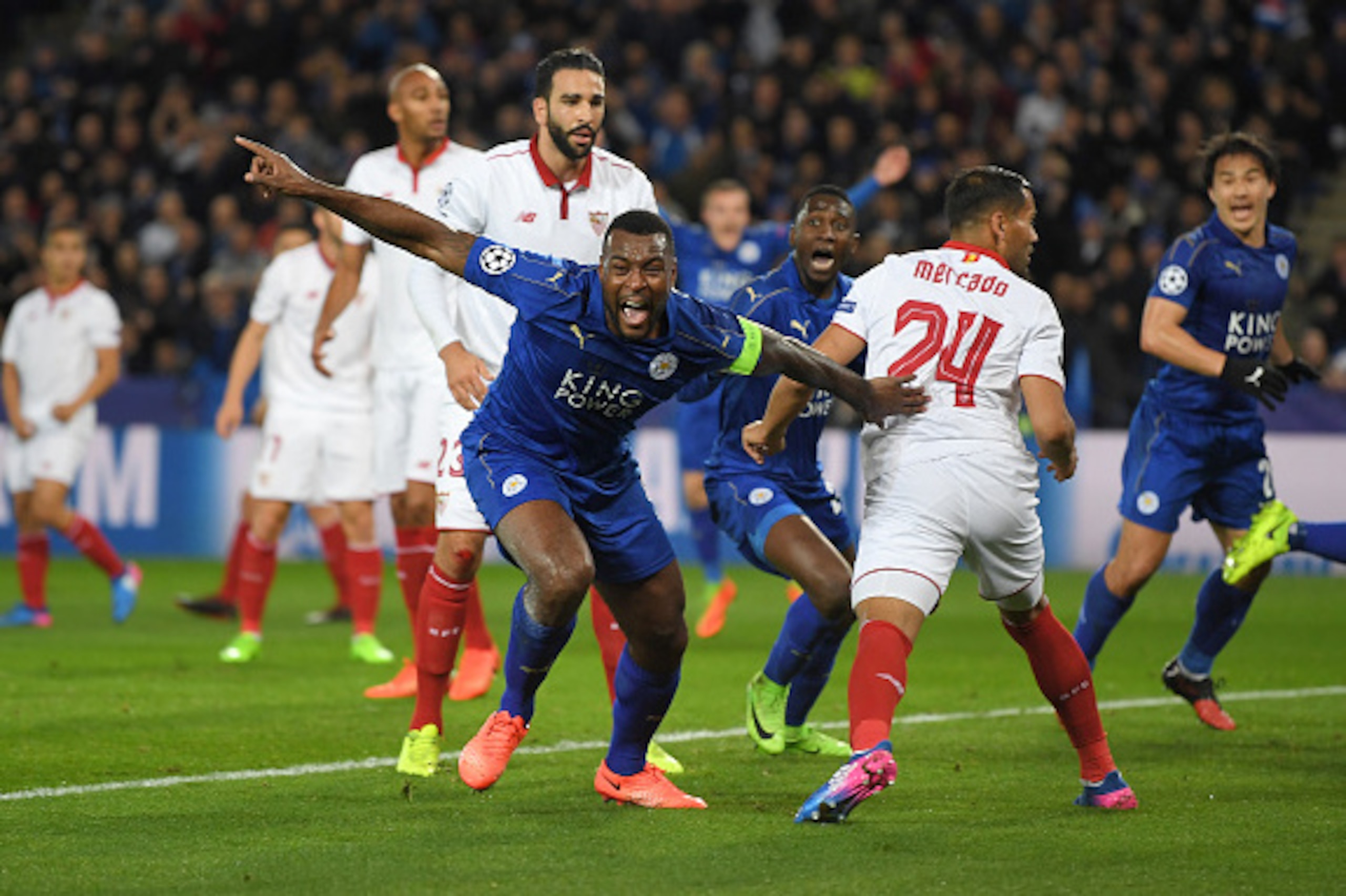 LEICESTER, ENGLAND - MARCH 14: Wes Morgan of Leicester City celebrates scoring the opening goal during the UEFA Champions League Round of 16 second leg match between Leicester City and Sevilla FC at The King Power Stadium on March 14, 2017 in Leicester, U