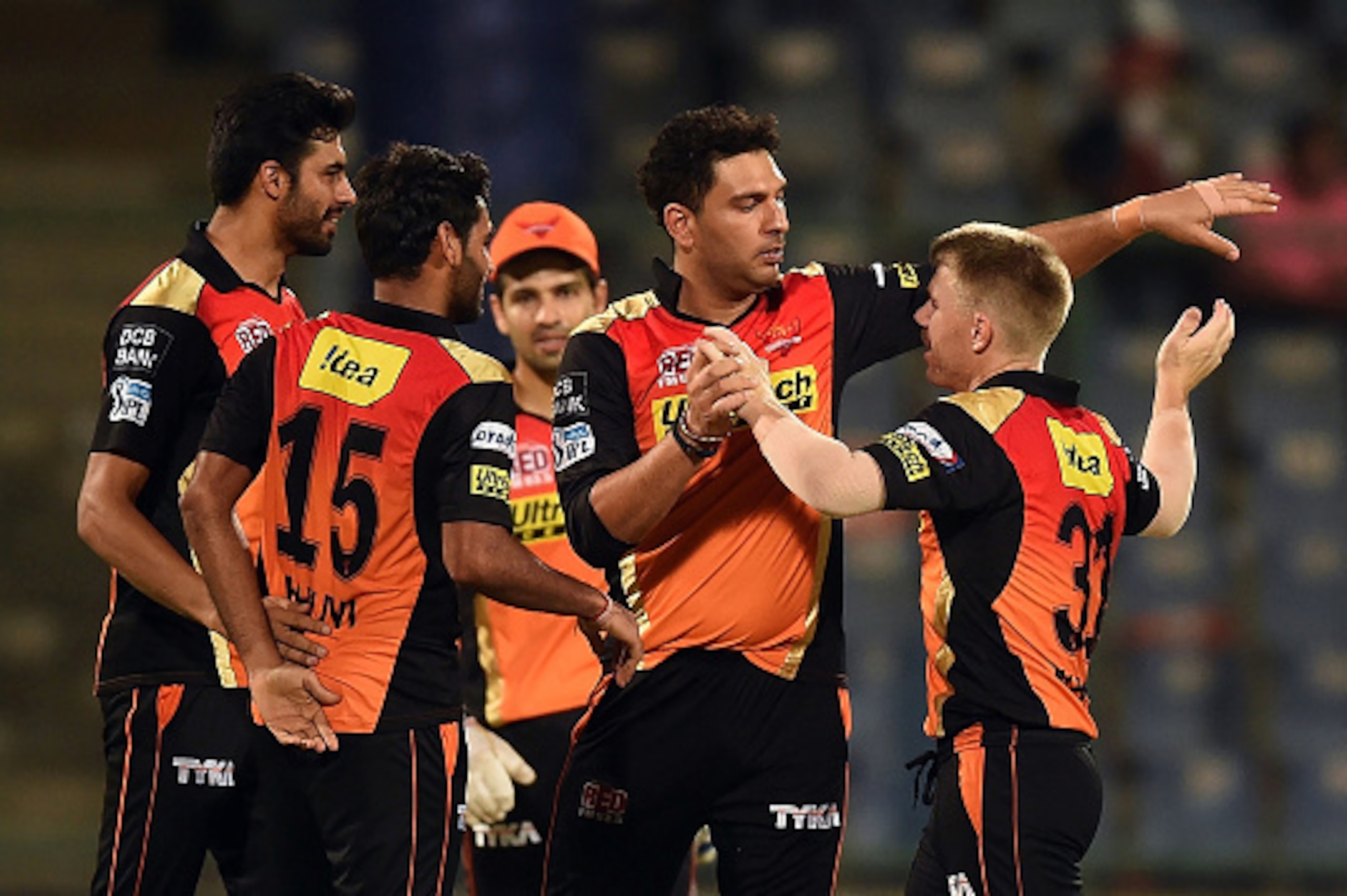 Sunrisers Hyderabad captain David Warner (R) celebrates the victory over Kolkata Knight Riders with teammates  during the 2016 Indian Premier League (IPL) Twenty20 eliminator cricket match between Kolkata Knight Riders and Sunrisers Hyderabad at the Feroz