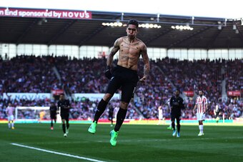 STOKE ON TRENT, ENGLAND - APRIL 08: Roberto Firmino of Liverpool celebrates scoring his side's second goal during the Premier League match between Stoke City and Liverpool at Bet365 Stadium on April 8, 2017 in Stoke on Trent, England. (Photo by Chris Brun