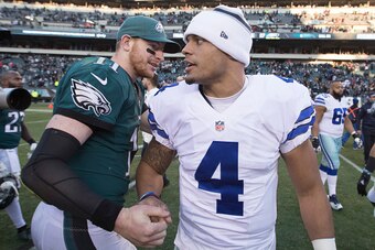 PHILADELPHIA, PA - JANUARY 1: Carson Wentz #11 of the Philadelphia Eagles hugs Dak Prescott #4 of the Dallas Cowboys after the game at Lincoln Financial Field on January 1, 2017 in Philadelphia, Pennsylvania. The Eagles defeated the Cowboys 27-13. (Photo 