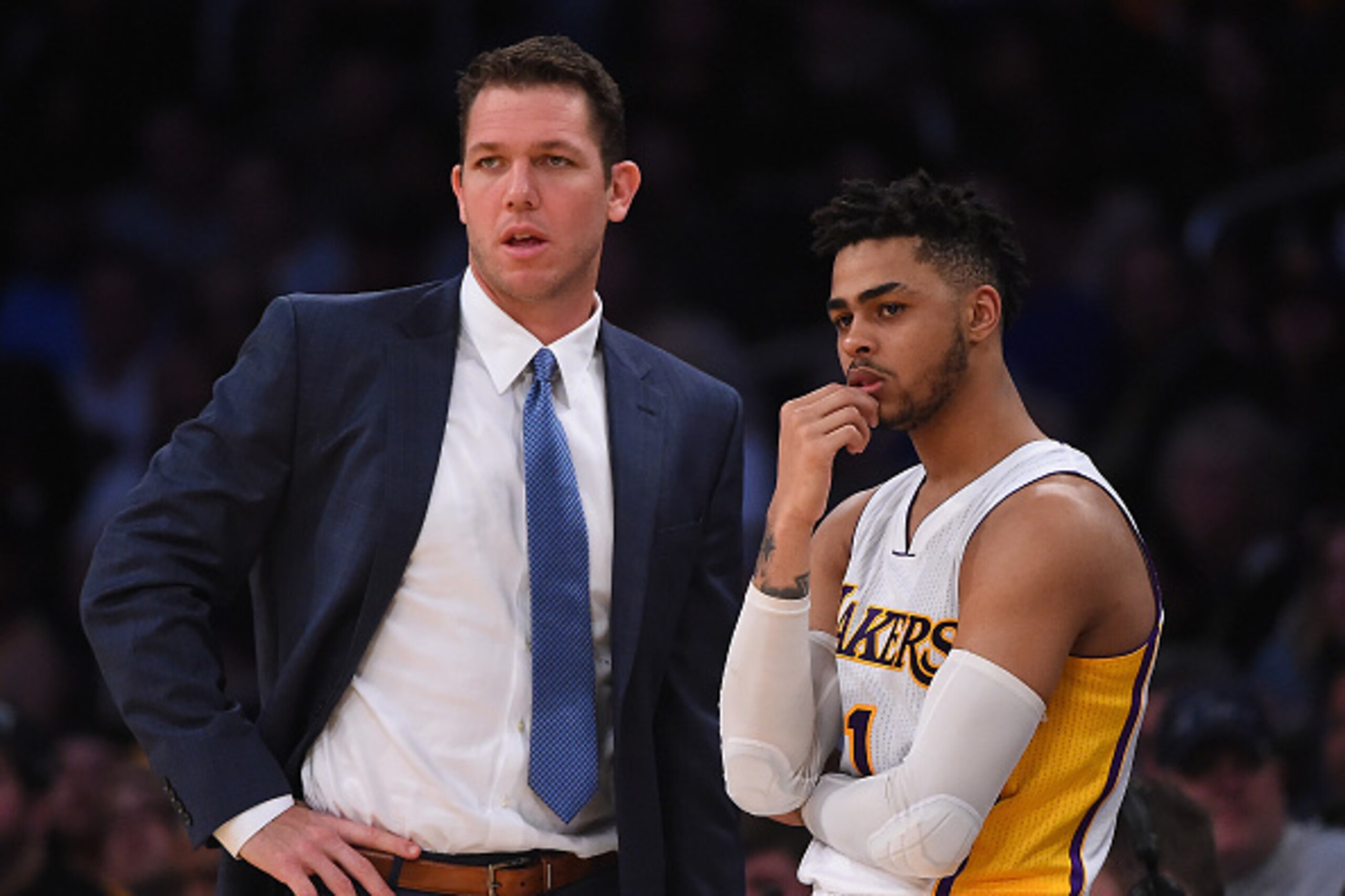LOS ANGELES, CA - MARCH 26:  Luke Walton, head coach of the Los Angeles Lakers, talks with D'Angelo Russell #1 as he waits to enter the first half of the game against the Portland Trail Blazers at Staples Center on March 26, 2017 in Los Angeles, Californi