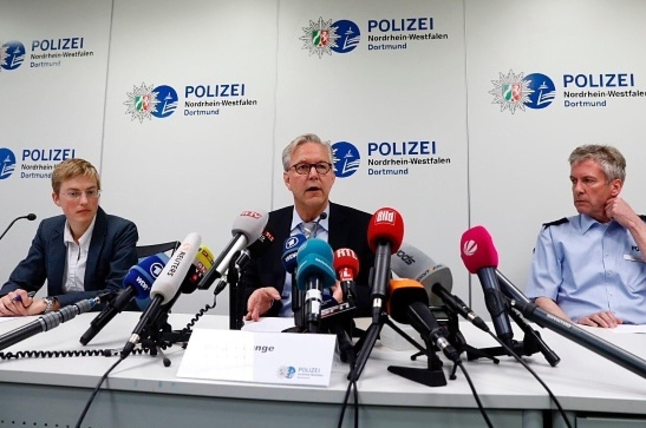 (L-R) State Prosecutor Sandra Luecke, Dortmund Chief of Police, Gregor Lange and Police Superintendent Michael Stein addresses a press conference at Police headquaters after the game was postponed due to the explosion which hit the Borussia Dortmund team 