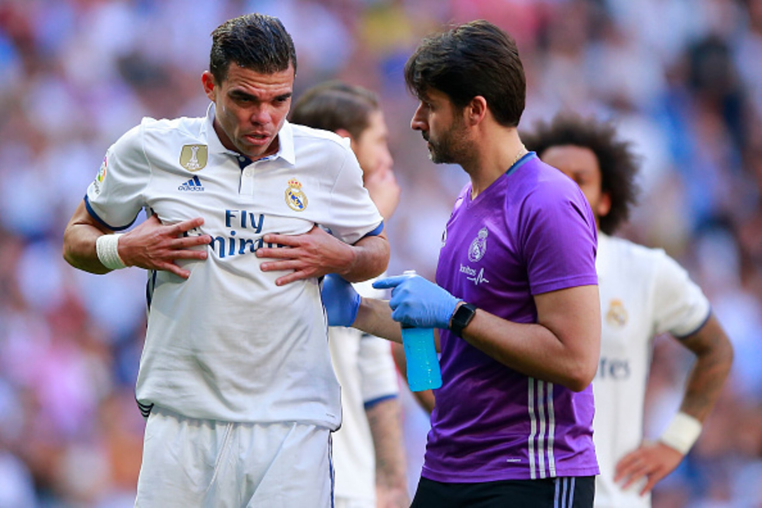 MADRID, SPAIN - APRIL 08:  Pepe of Real Madrid CF grimmaces in pain after being tackled by his teammate Toni Kroos (R) during the La Liga match between Real Madrid CF and Club Atletico de Madrid at Estadio Santiago Bernabeu on April 8, 2017 in Madrid, Spa