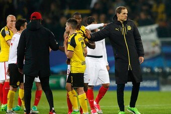 Dortmund's head coach Thomas Tuchel (R) comforts his players after the UEFA Champions League 1st leg quarter-final football match BVB Borussia Dortmund v Monaco in Dortmund, western Germany on April 12, 2017.
The match had been postponed one day after thr