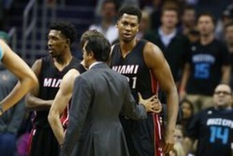Apr 5, 2017; Charlotte, NC, USA; Miami Heat center Hassan Whiteside (21) gets separated from Charlotte Hornets center Cody Zeller (not pictured) after a scuffle in the second half at Spectrum Center. The Heat won 112-99. Mandatory Credit: Jeremy Brevard-U