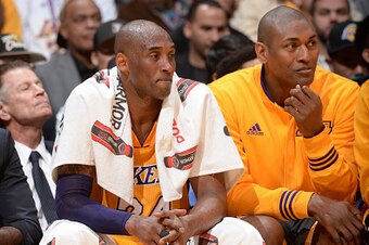 LOS ANGELES, CA - APRIL 13:  Kobe Bryant #24 and Metta World Peace #37 of the Los Angeles Lakers sit on the bench during the game against the Utah Jazz on April 13, 2016 at Staples Center in Los Angeles, California. NOTE TO USER: User expressly acknowledg