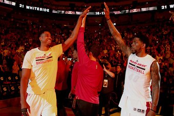 MIAMI, FL - APRIL 2:  Hassan Whiteside #21 of the Miami Heat high-fives his teammates before the game against the Denver Nuggets on April 2, 2017 at American Airlines Arena in Miami, Florida. NOTE TO USER: User expressly acknowledges and agrees that, by d