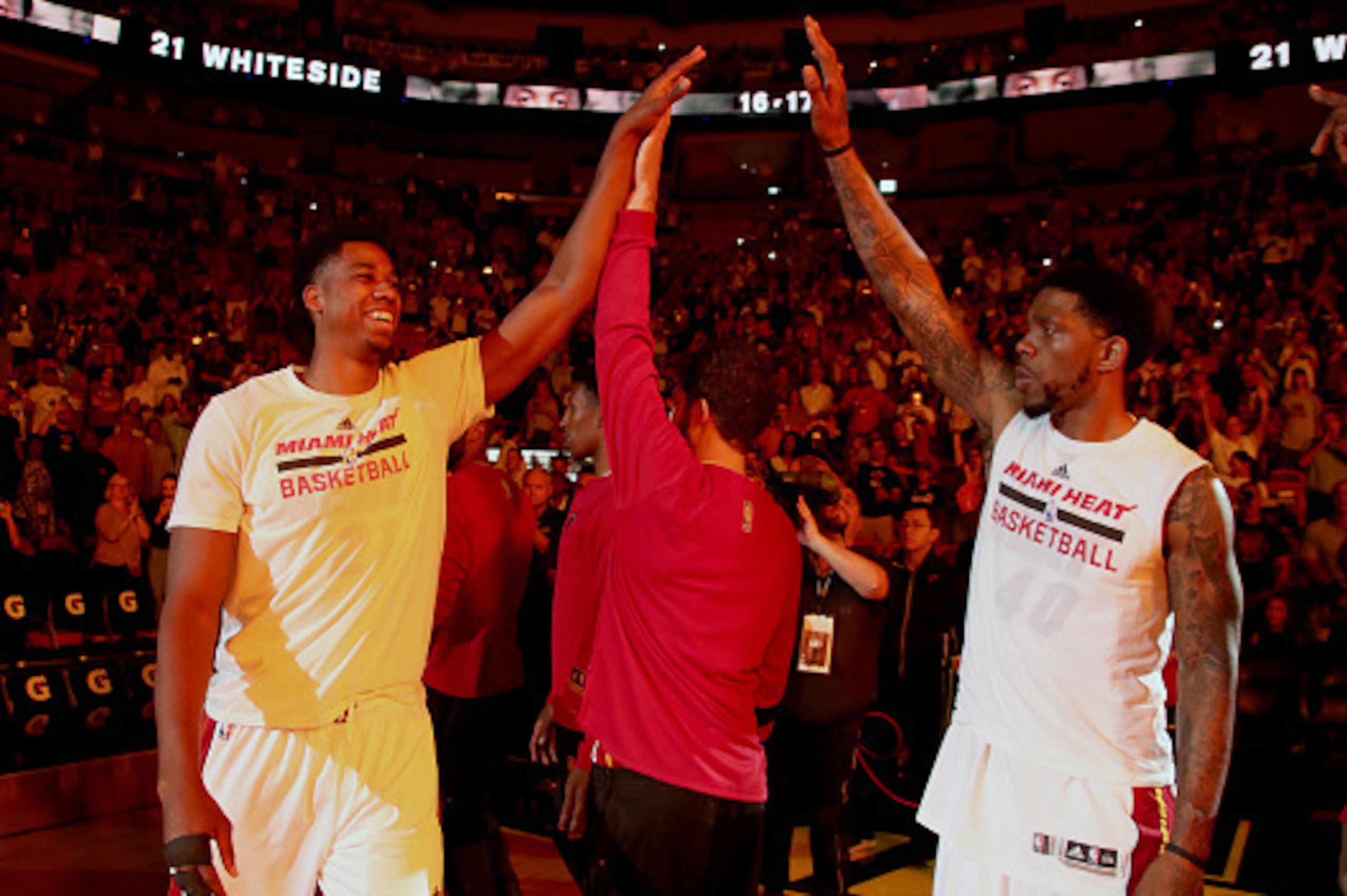 MIAMI, FL - APRIL 2:  Hassan Whiteside #21 of the Miami Heat high-fives his teammates before the game against the Denver Nuggets on April 2, 2017 at American Airlines Arena in Miami, Florida. NOTE TO USER: User expressly acknowledges and agrees that, by d