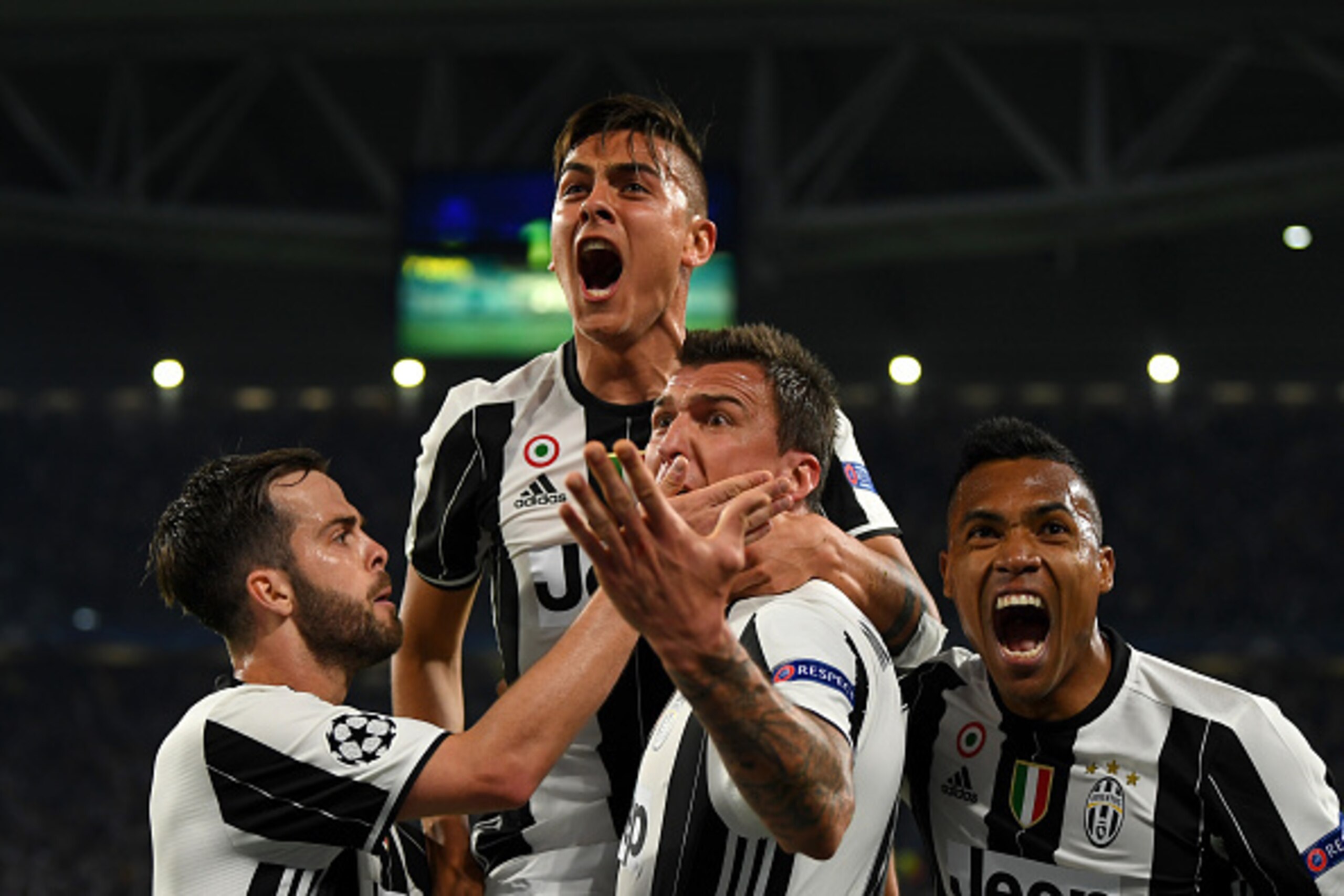 TURIN, ITALY - APRIL 11: Paulo Dybala of Juventus celebrates with Miralem Pjanic, Mario Mandzukic and Alex Sandro of Juventus after scoring his team's second goal during the UEFA Champions League Quarter Final first leg match between Juventus and FC Barc TURIN, ITALY - APRIL 11: Paulo Dybala of Juventus celebrates with Miralem Pjanic, Mario Mandzukic and Alex Sandro of Juventus after scoring his team's second goal during the UEFA Champions League Quarter Final first leg match between Juventus and FC Barc