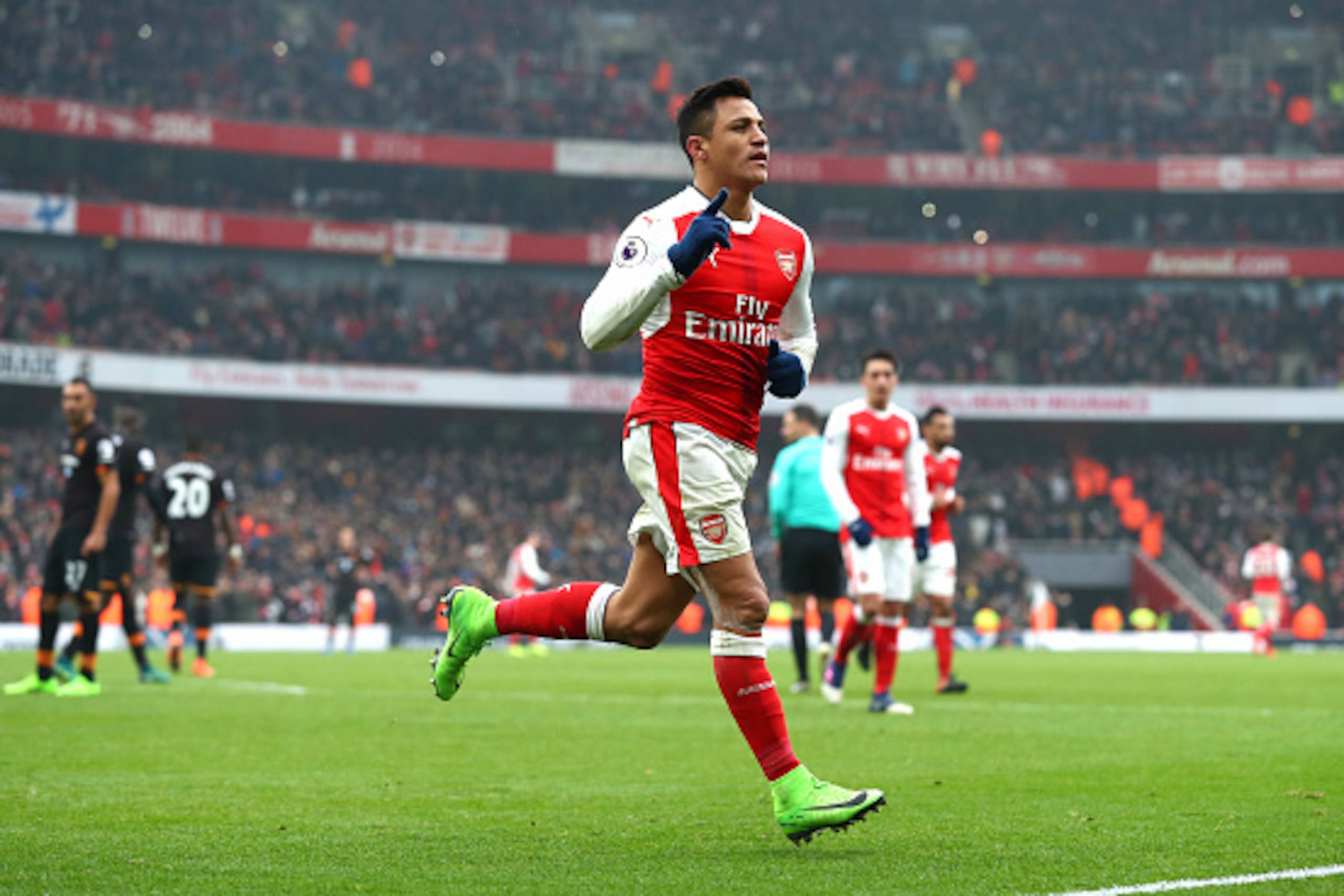 LONDON, ENGLAND - FEBRUARY 11:  Alexis Sanchez of Arsenal celebrates scoring his side's second goal from the penalty spot during the Premier League match between Arsenal and Hull City at Emirates Stadium on February 11, 2017 in London, England.  (Photo by